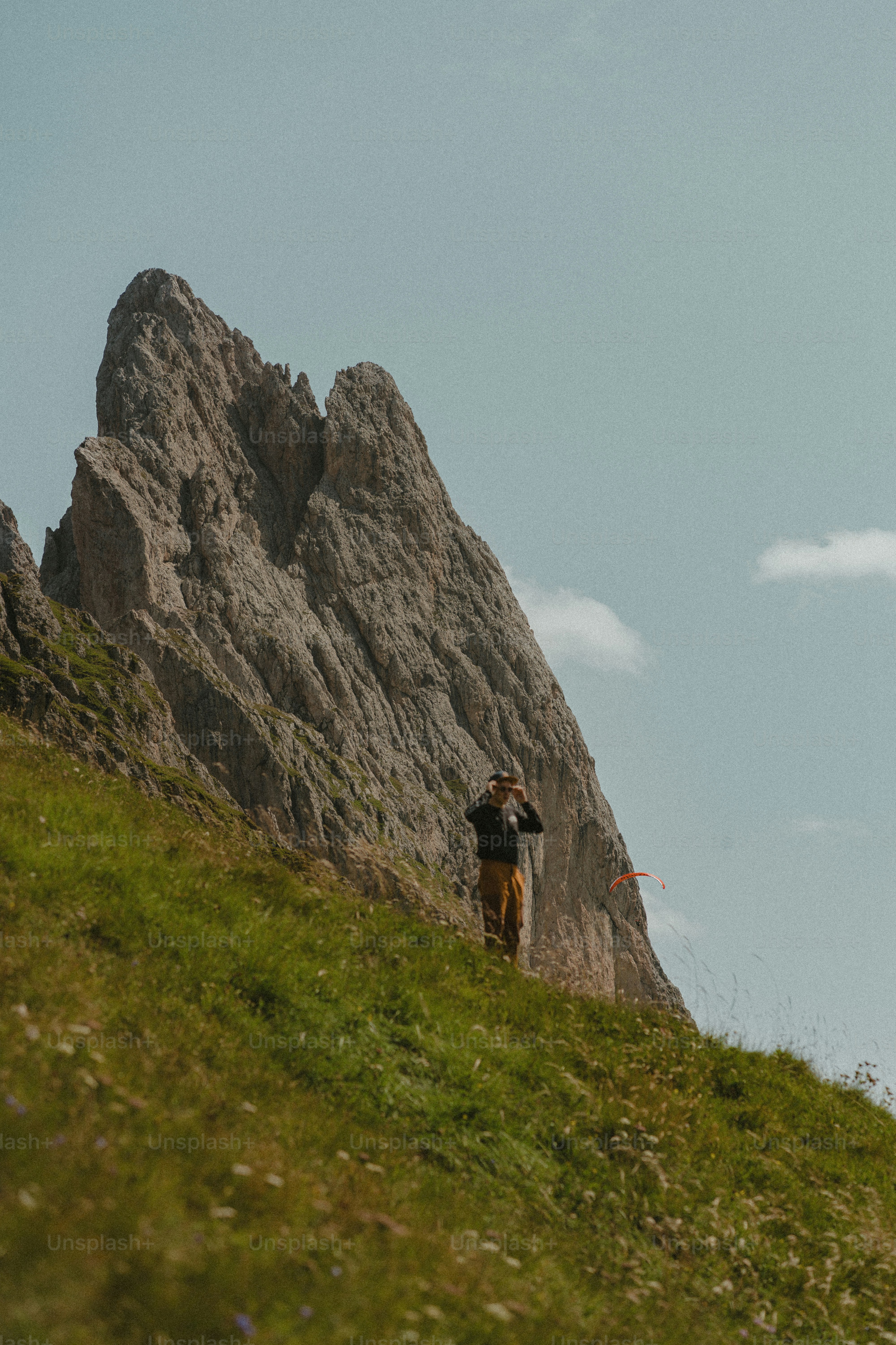 Man gazes at a mountain peak.