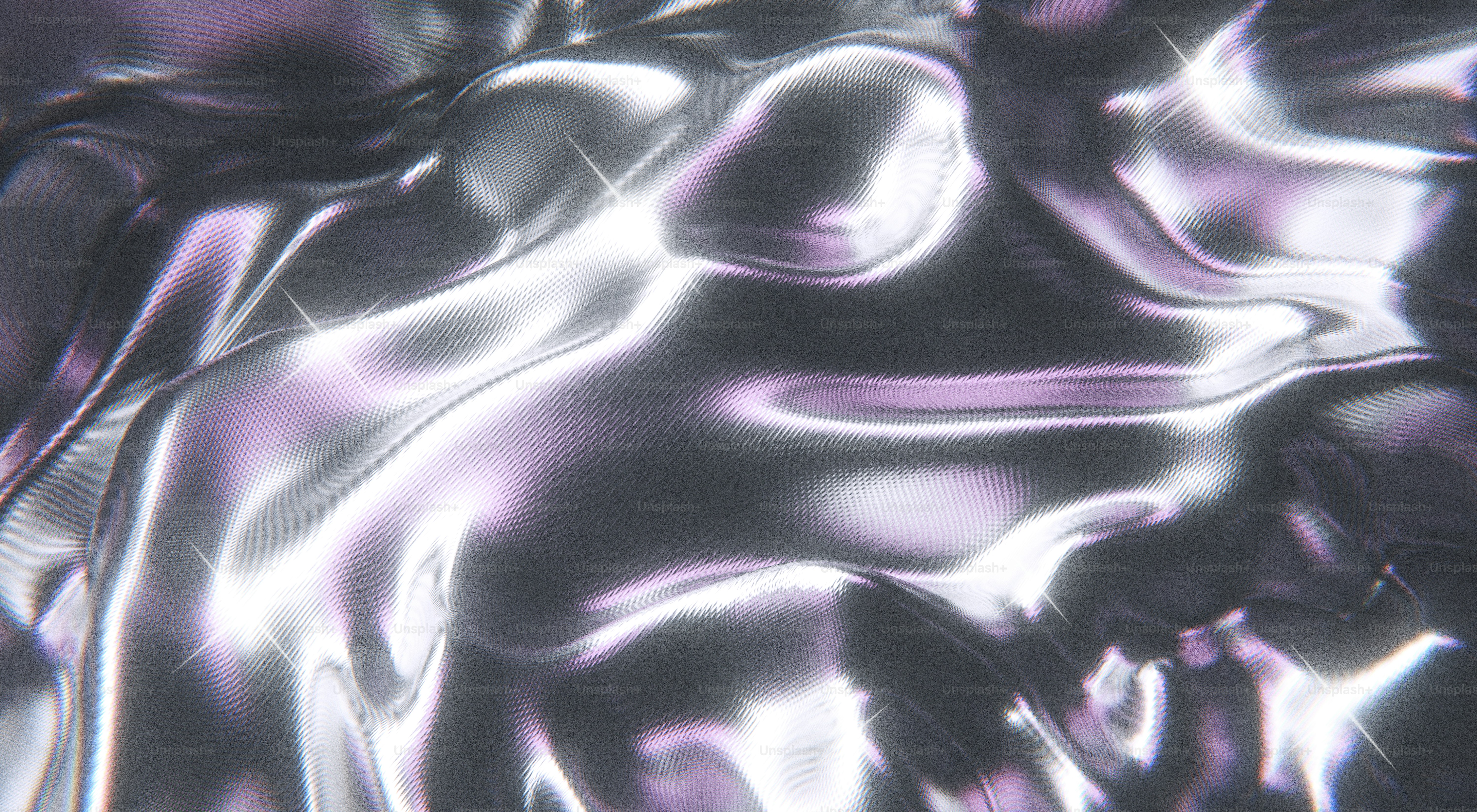Flowing and reflective abstract metallic surface.