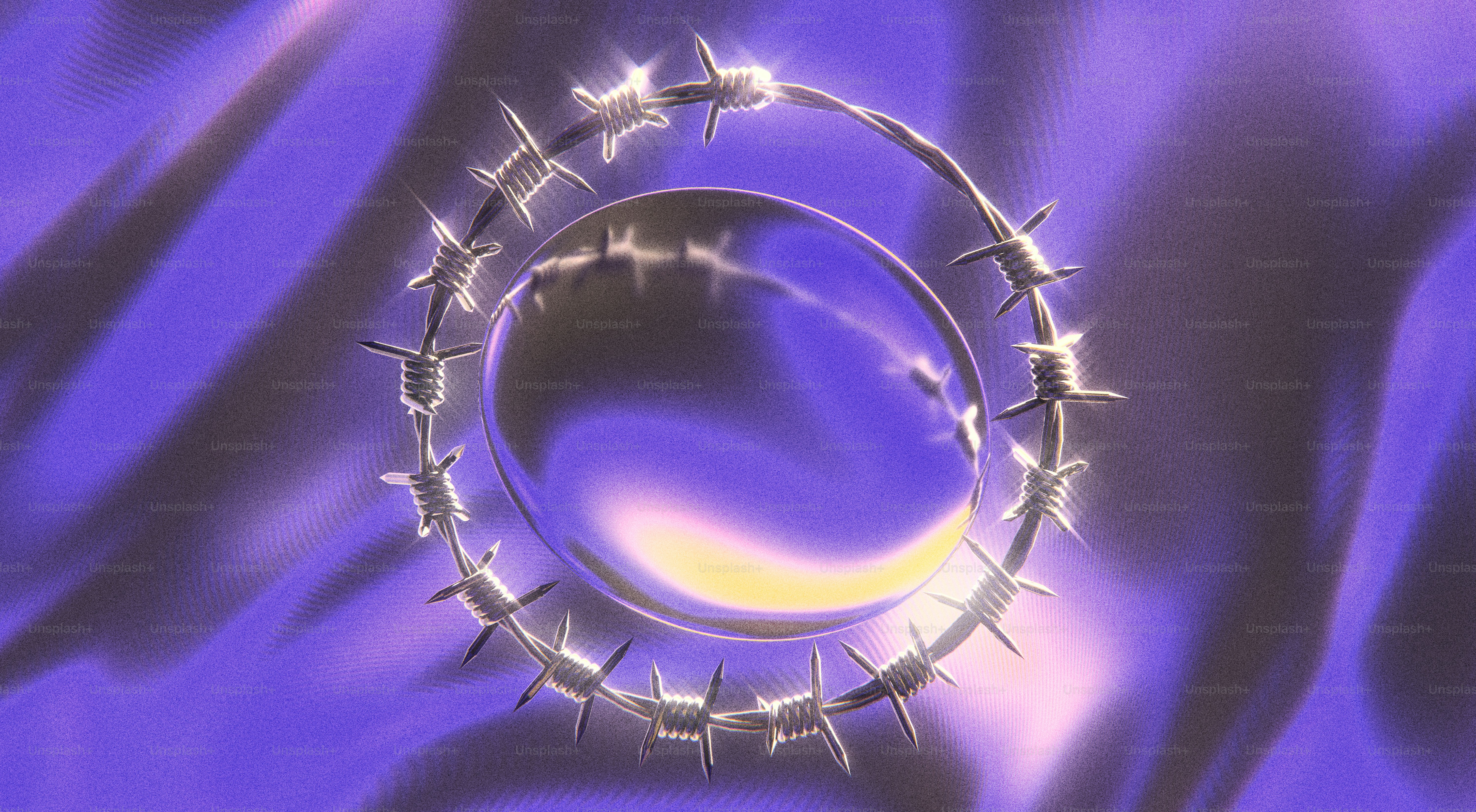 A shiny, barbed wire circle floats above ripples.