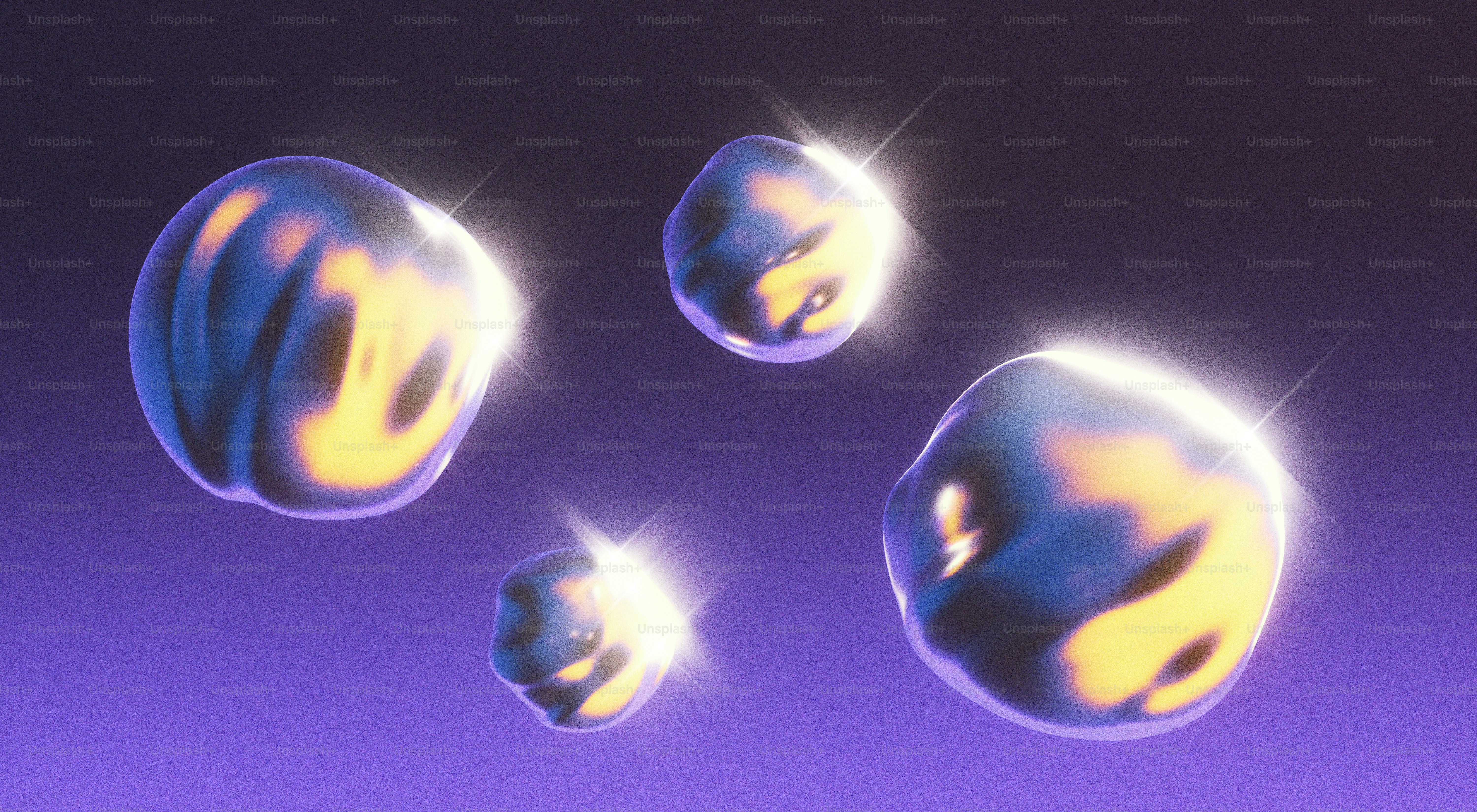 Four shining, floating orbs against a purple background.