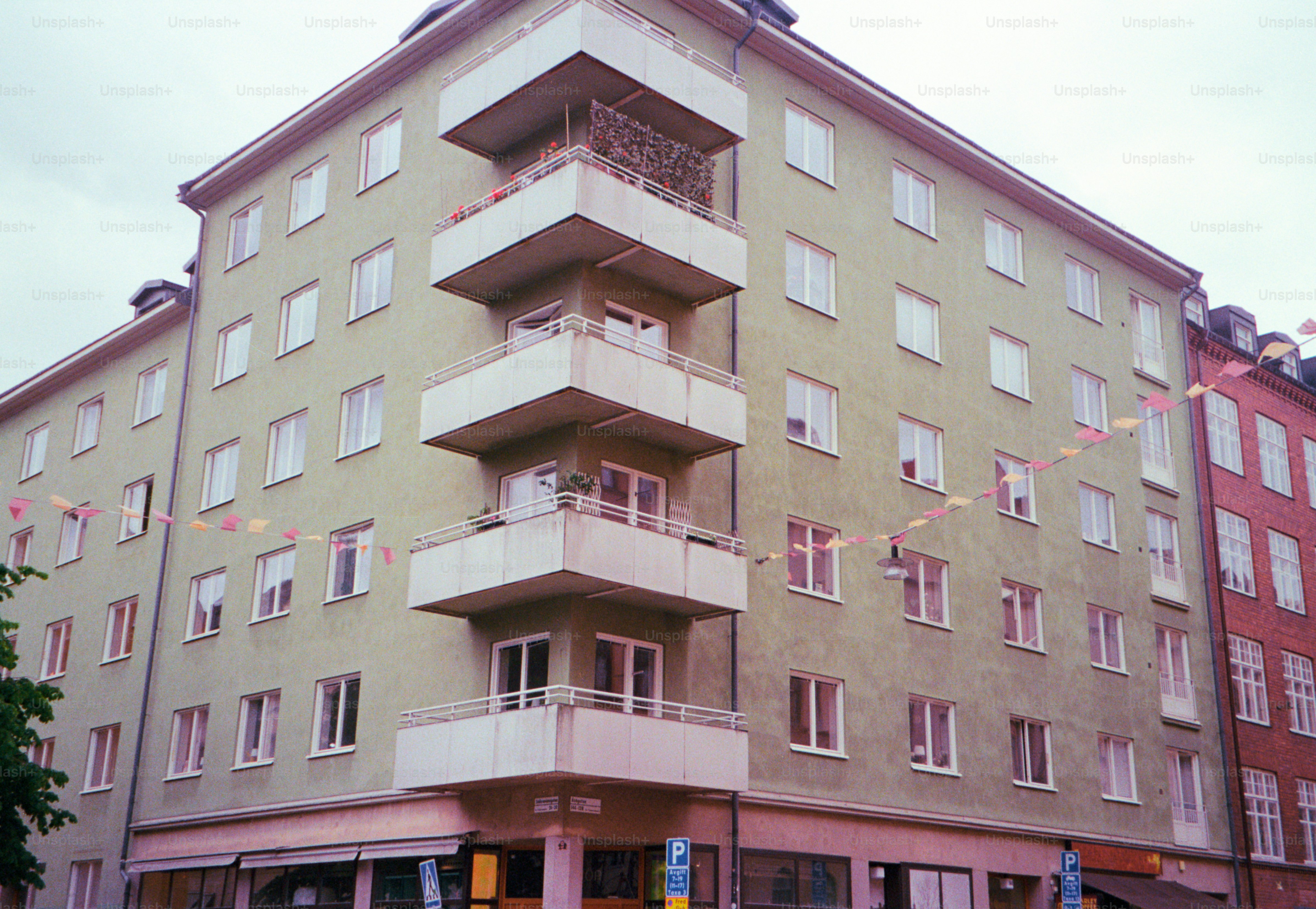 Apartment building with several balconies and windows.