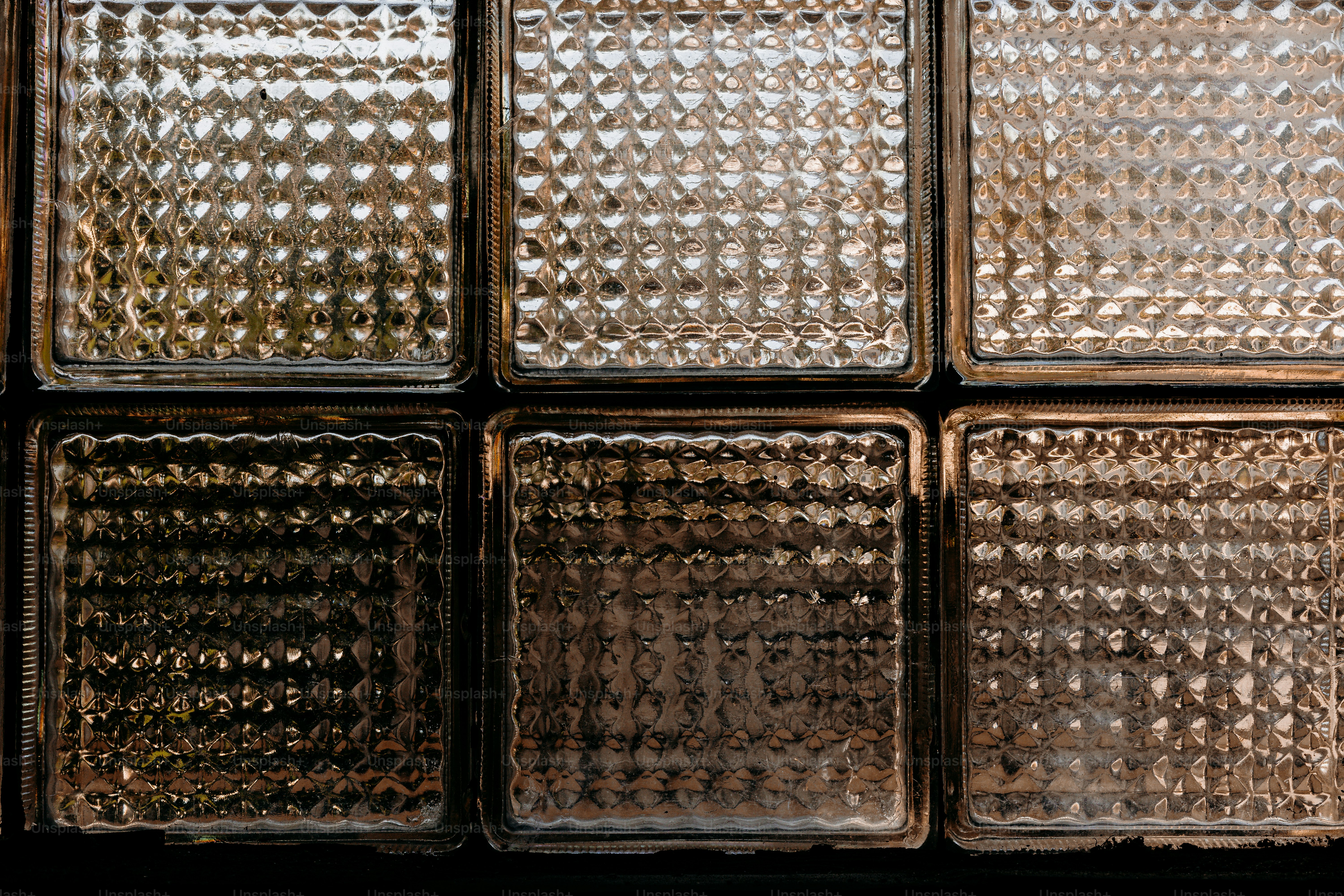 Patterned glass blocks in a wall