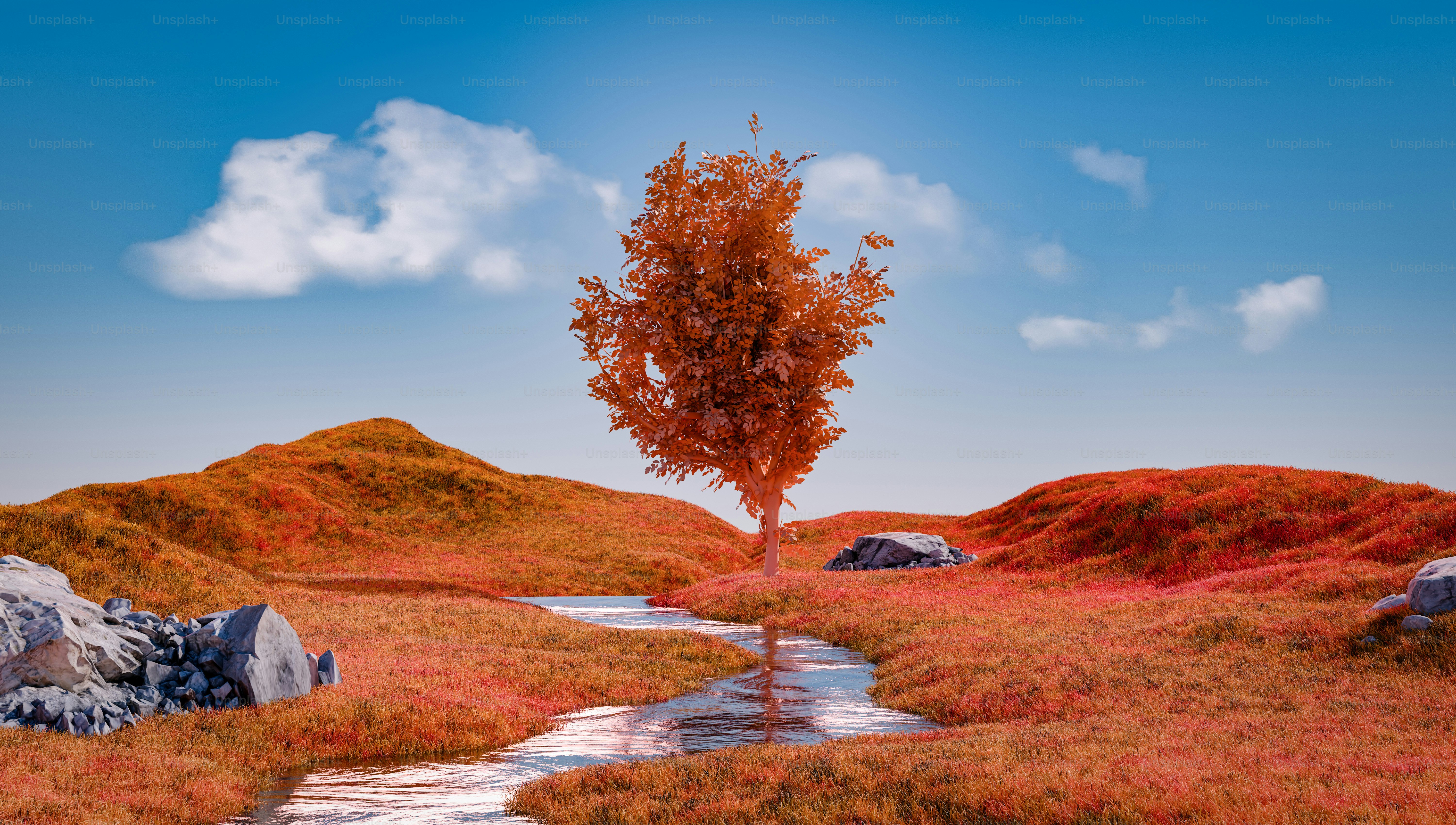 A lonely tree stands in an orange landscape.