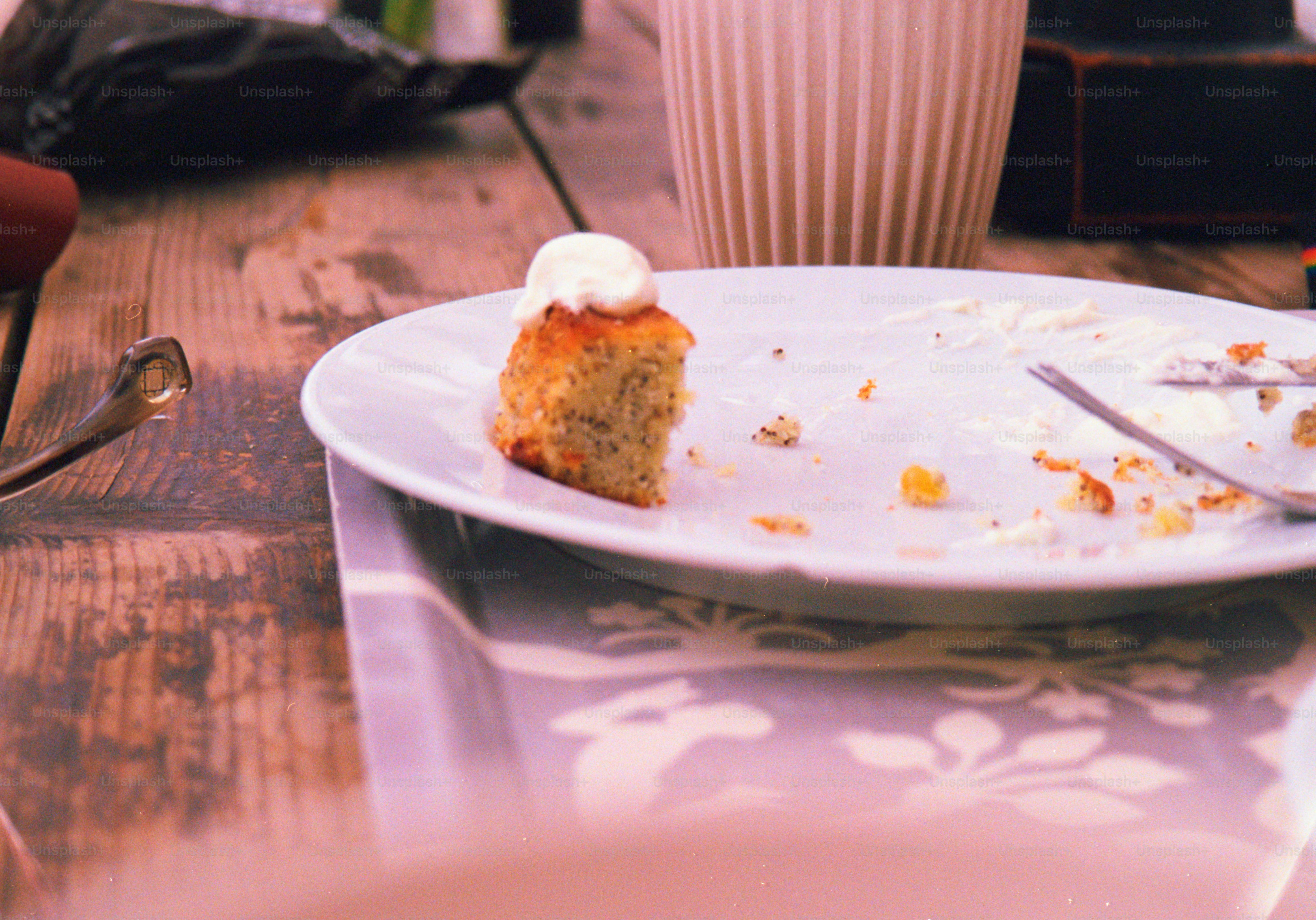 A cake slice sits on a nearly empty plate.