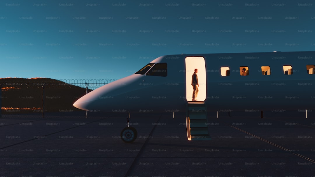 A person exits a private jet.