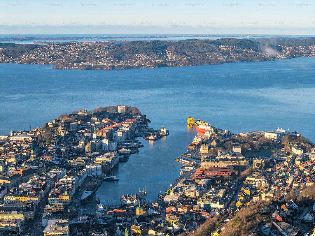 Daytime high aerial panorama historic city fjord town Bergen, Norway