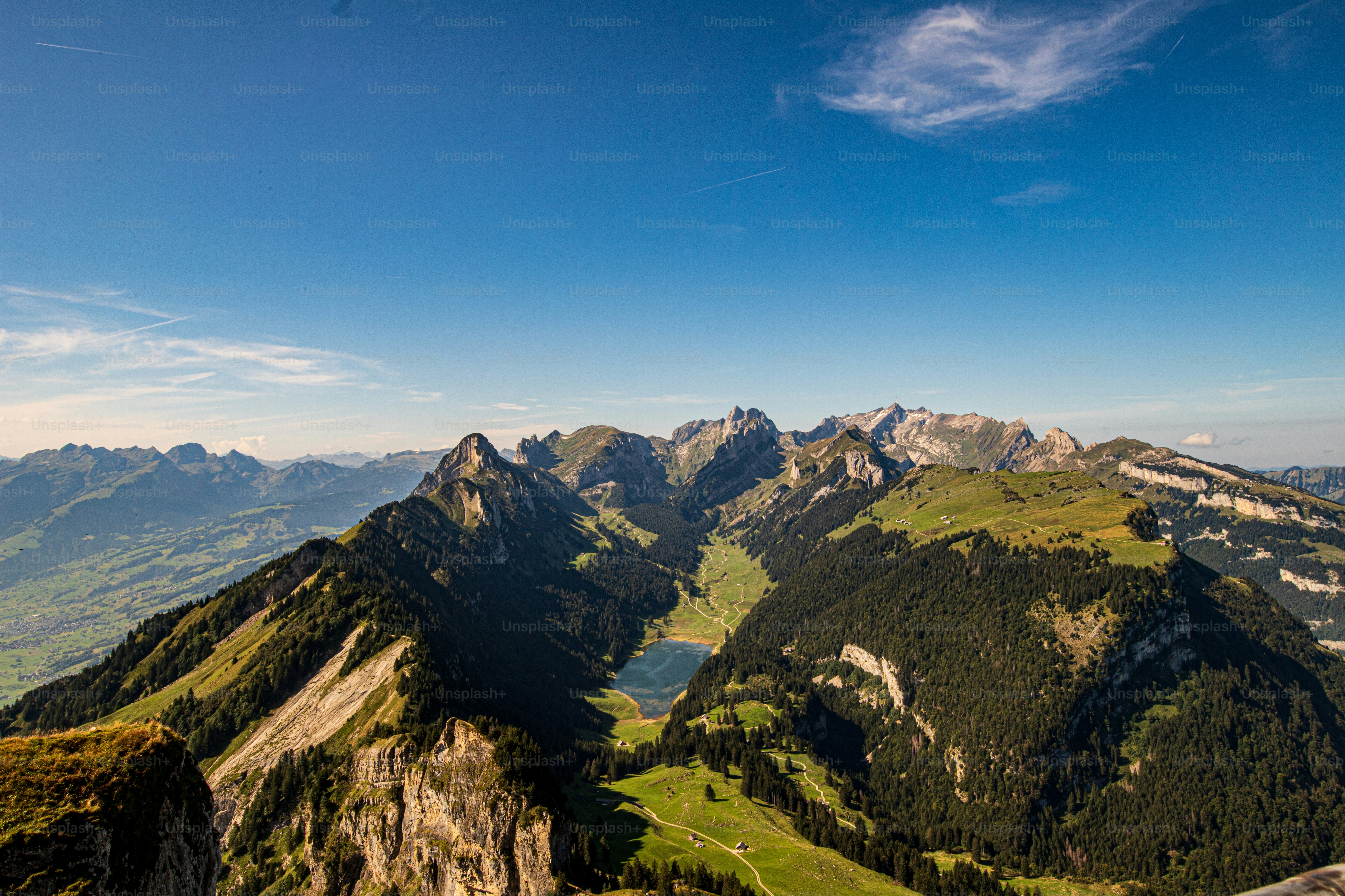 A mountain peak with trails, a cable car, a revolving restaurant and stunning panoramic views.