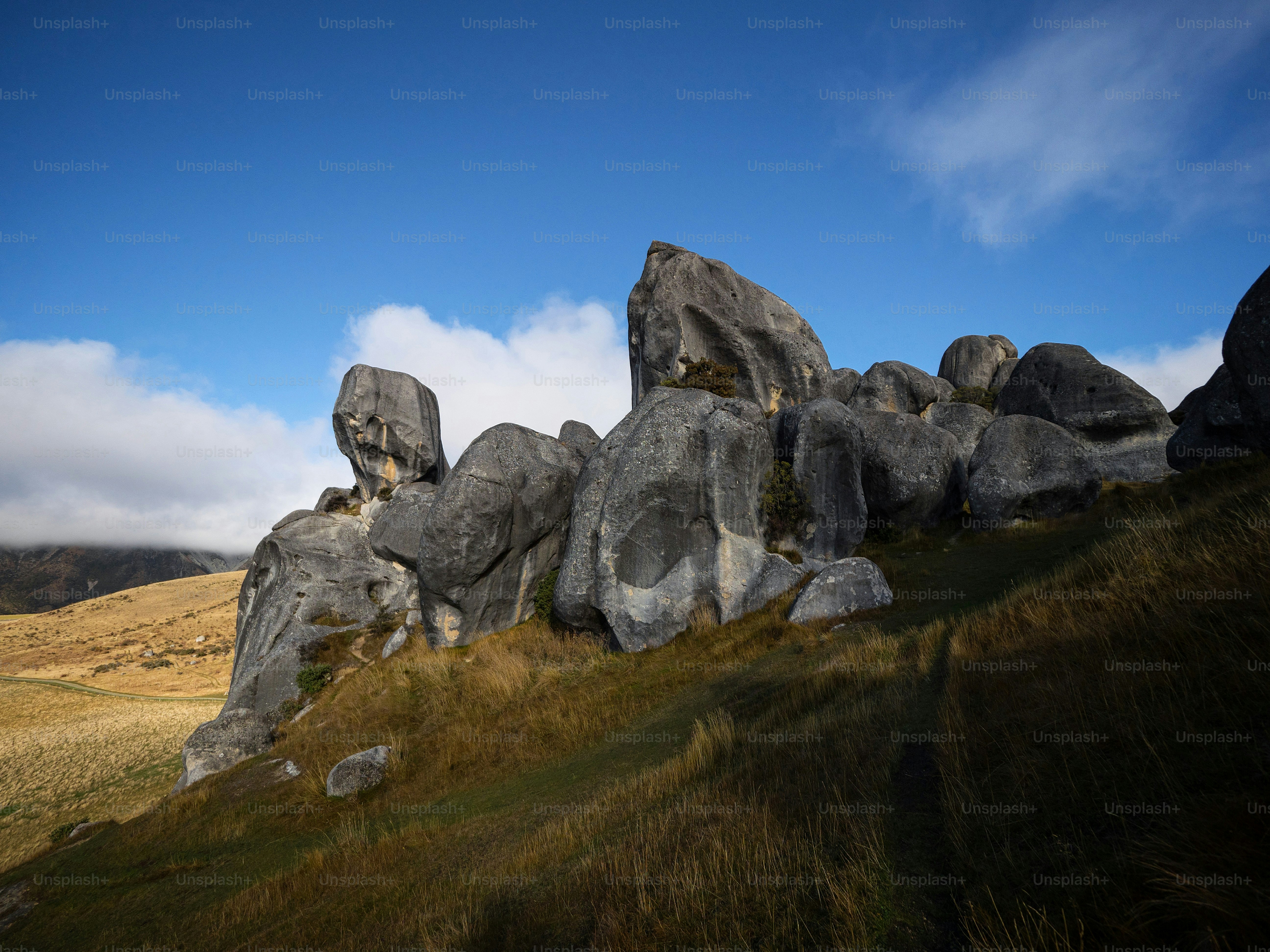 Nature landscape panorama view of large limestone boulder rocks in dry  grass vegetation at Castle Hill countryside park in Canterbury South Island  New Zealand photo – Travel Image on Unsplash, image size:3000x2250