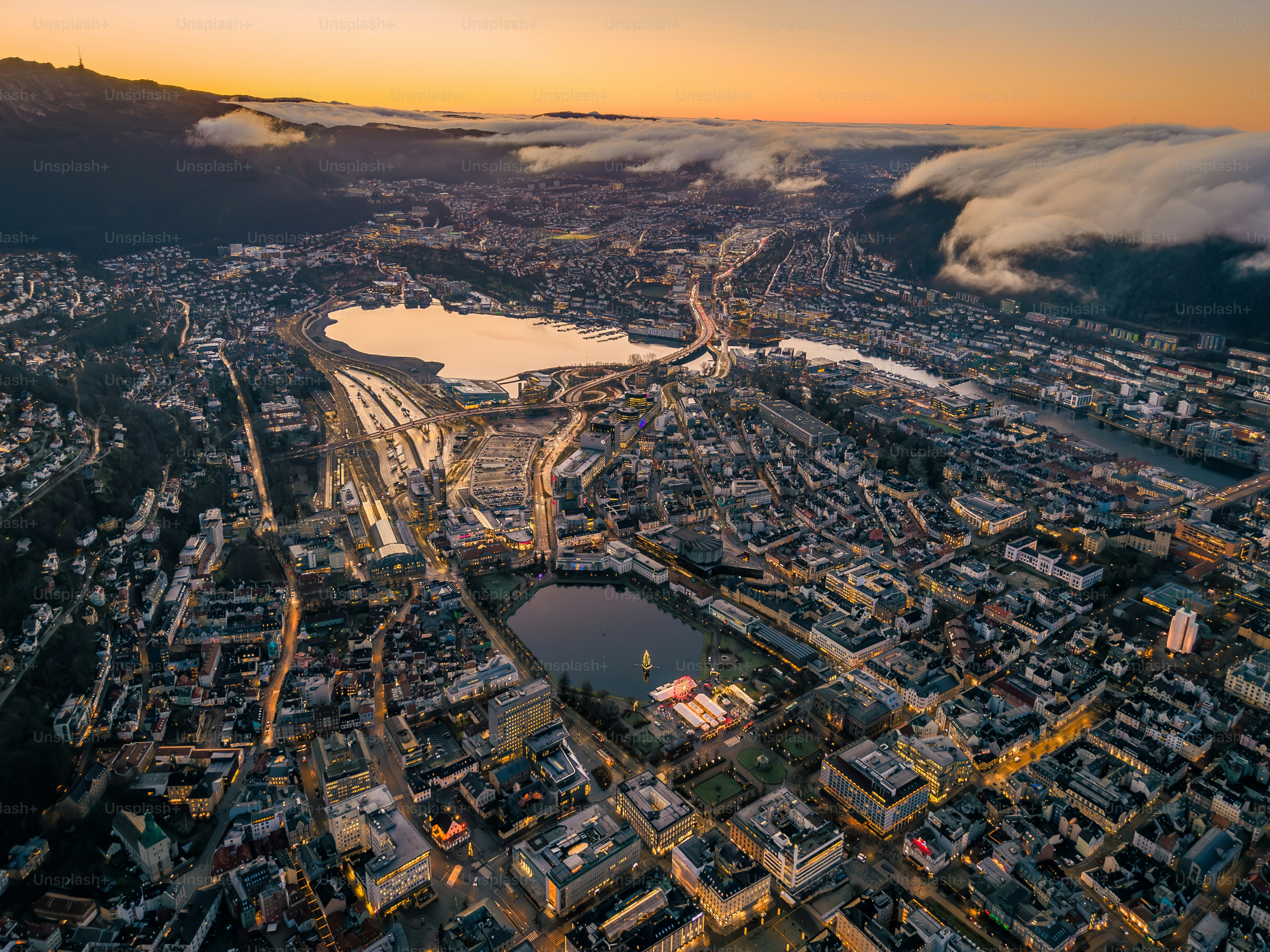 Night aerial of historic wooden Hanseatic fjord town Bergen, Norway