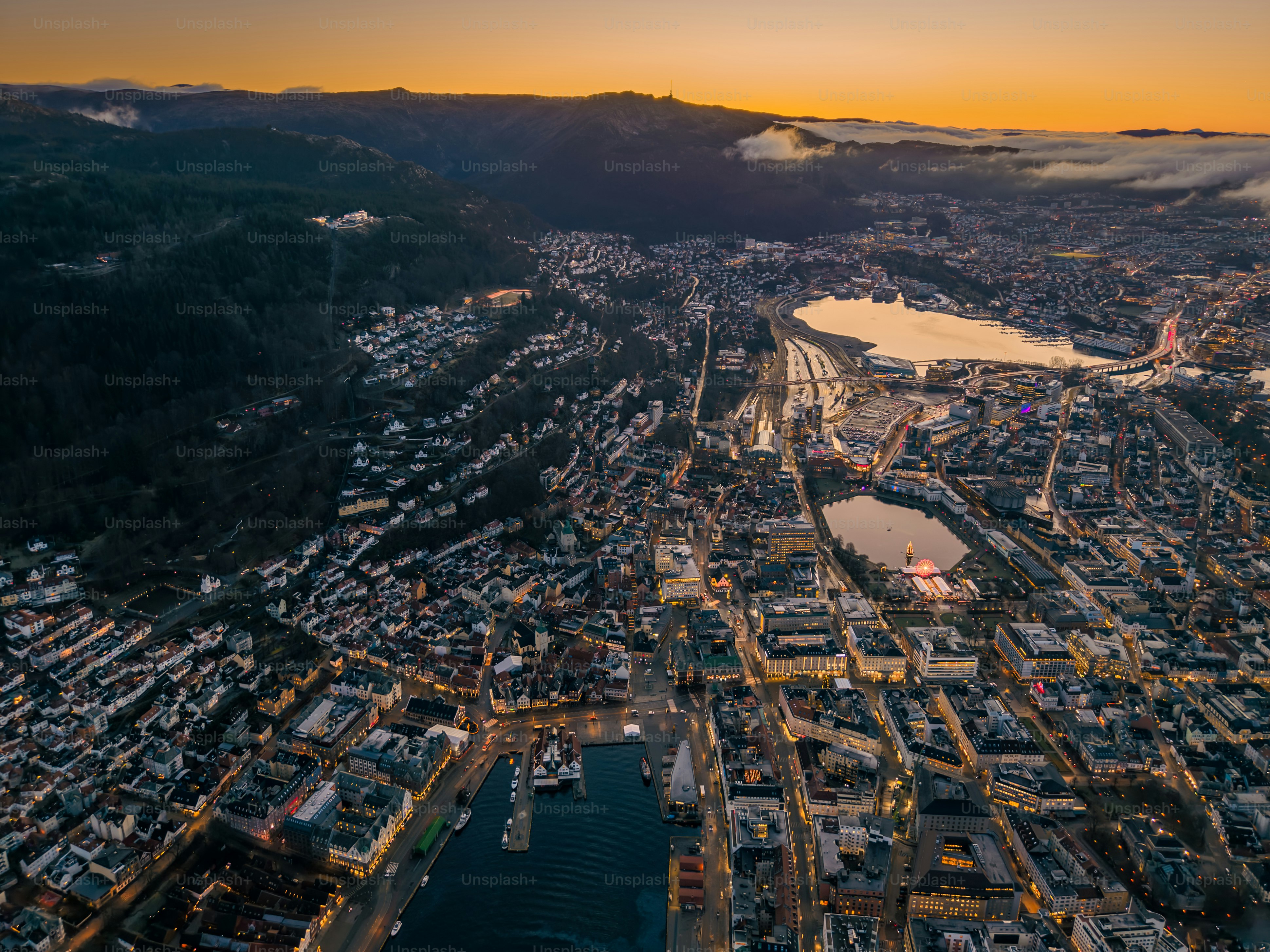 Night aerial of historic wooden Hanseatic fjord town Bergen, Norway