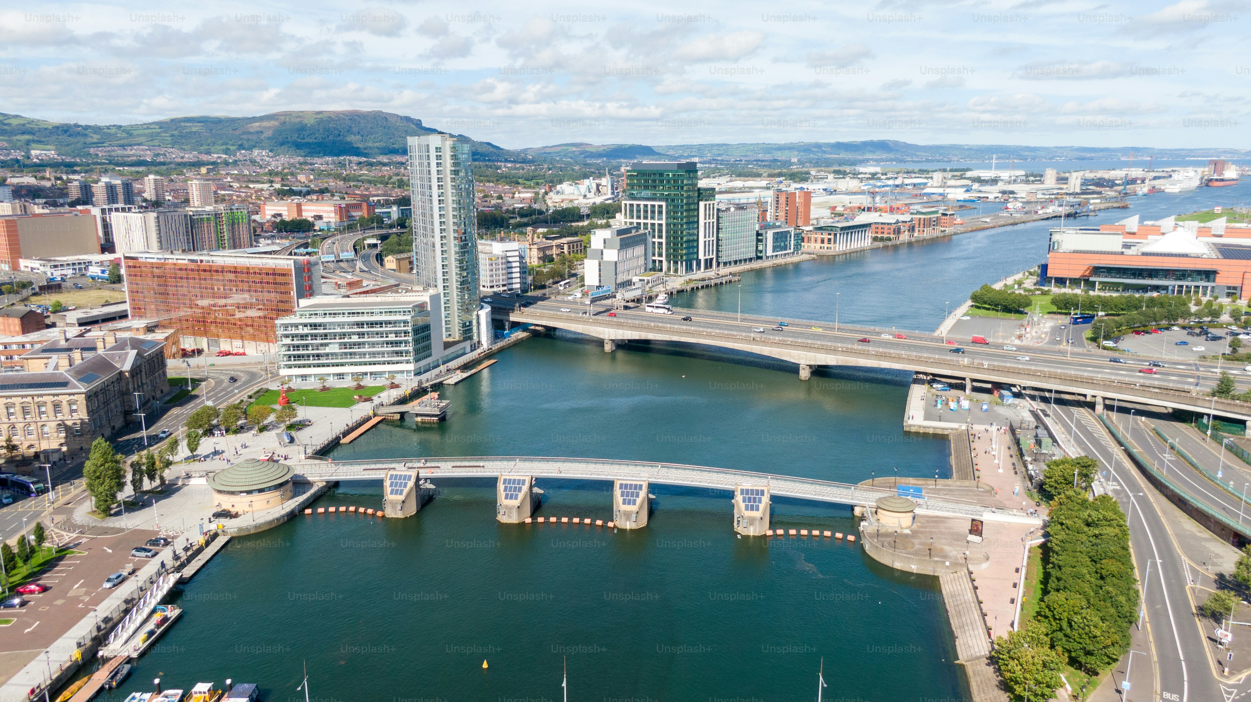 Aerial view on buildings and Lagan River in City center of Belfast Northern Ireland. Drone photo, high angle view of town
