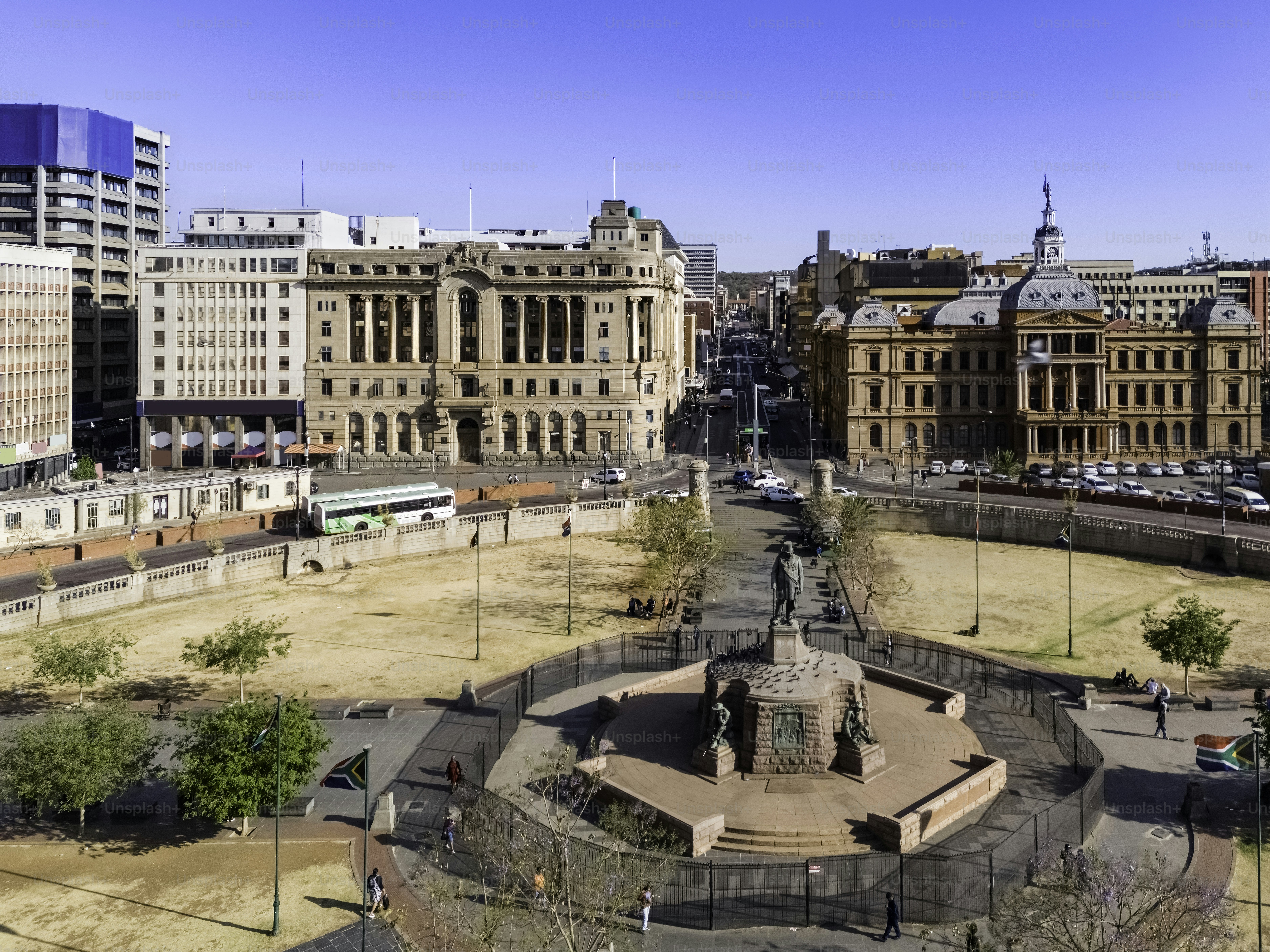 Pretoria church square with Paul Kruger statue and urban cityscape with its skyscrapers.