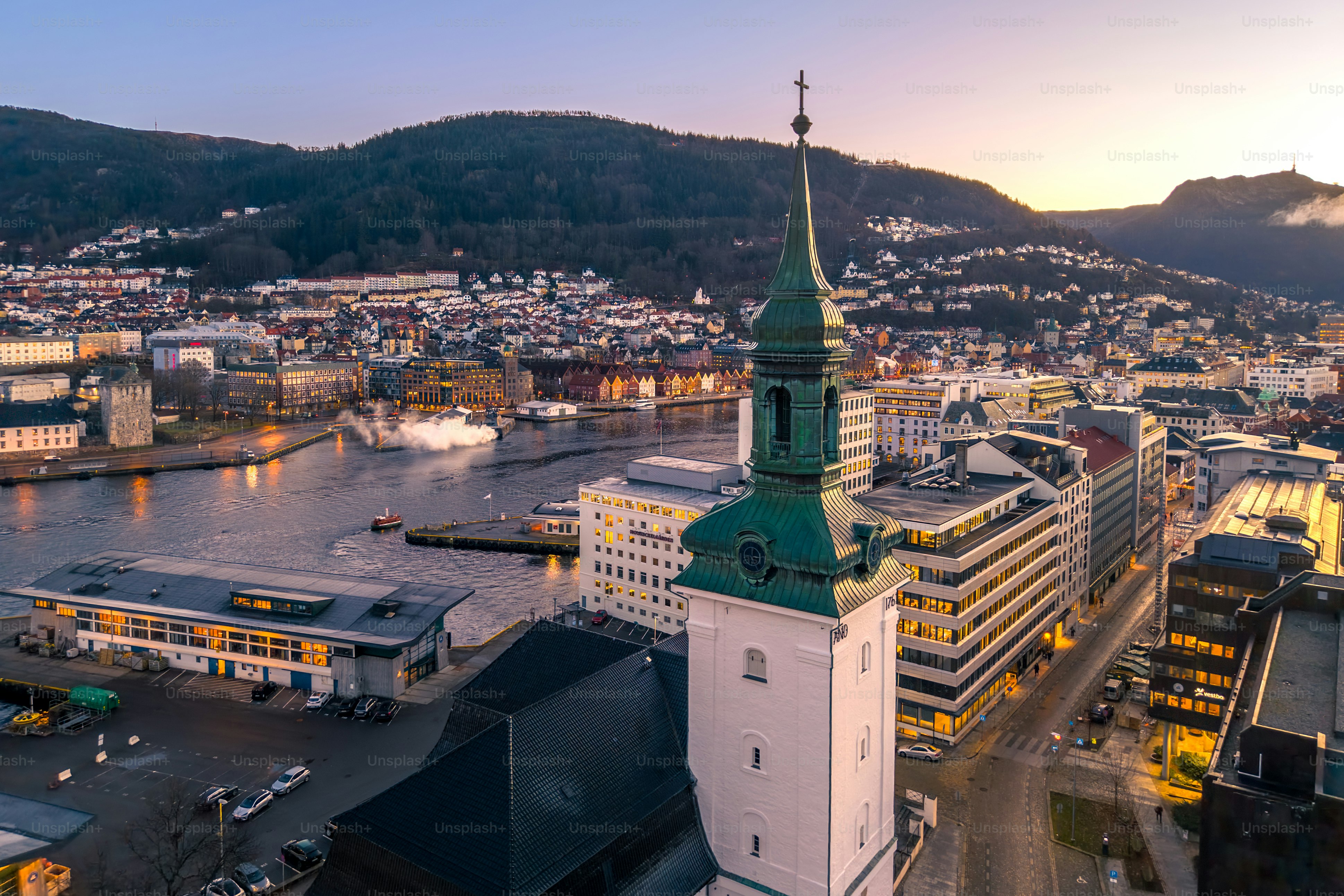 Night aerial of historic wooden Hanseatic fjord town Bergen, Norway