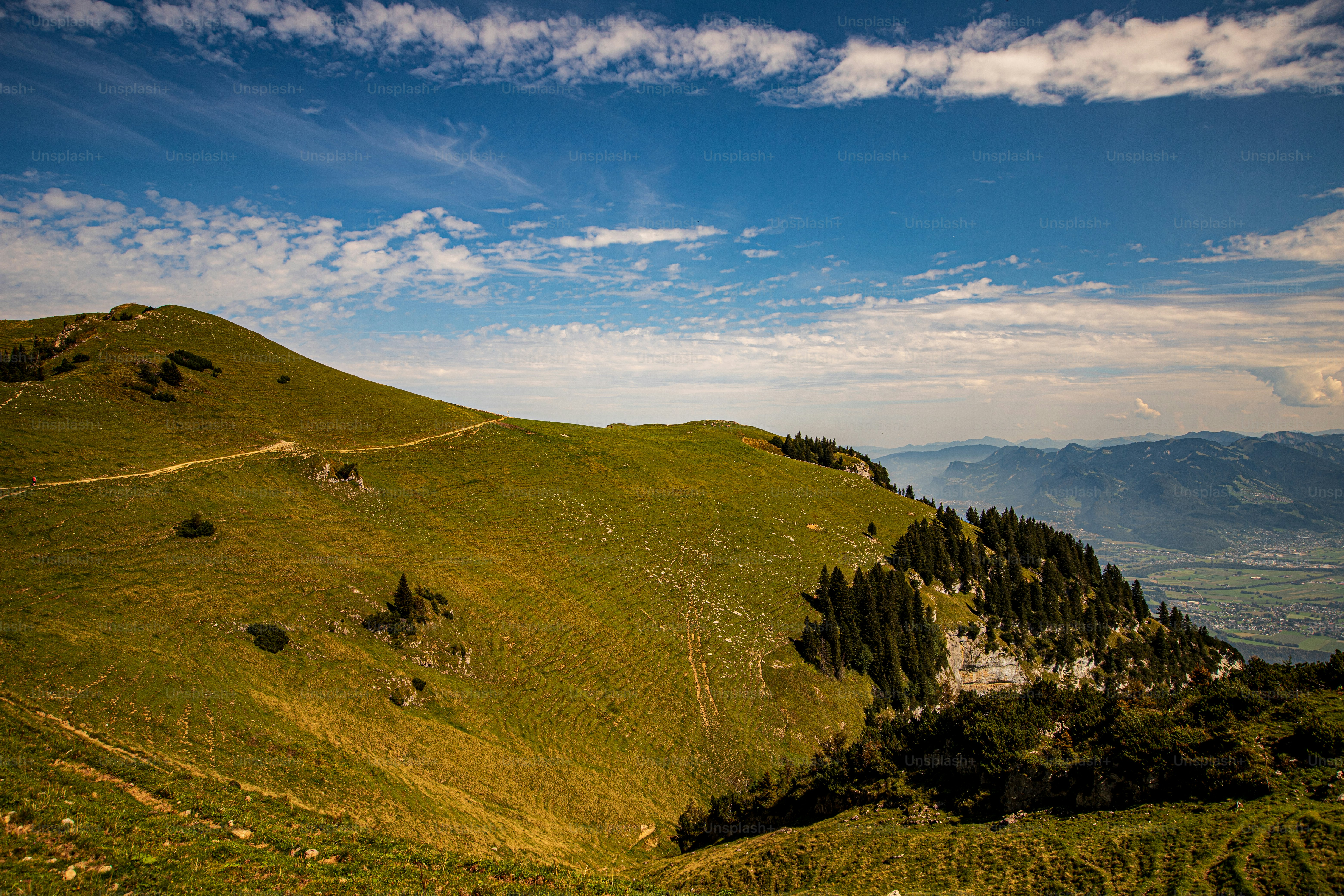 A mountain peak with trails, a cable car, a revolving restaurant and stunning panoramic views.