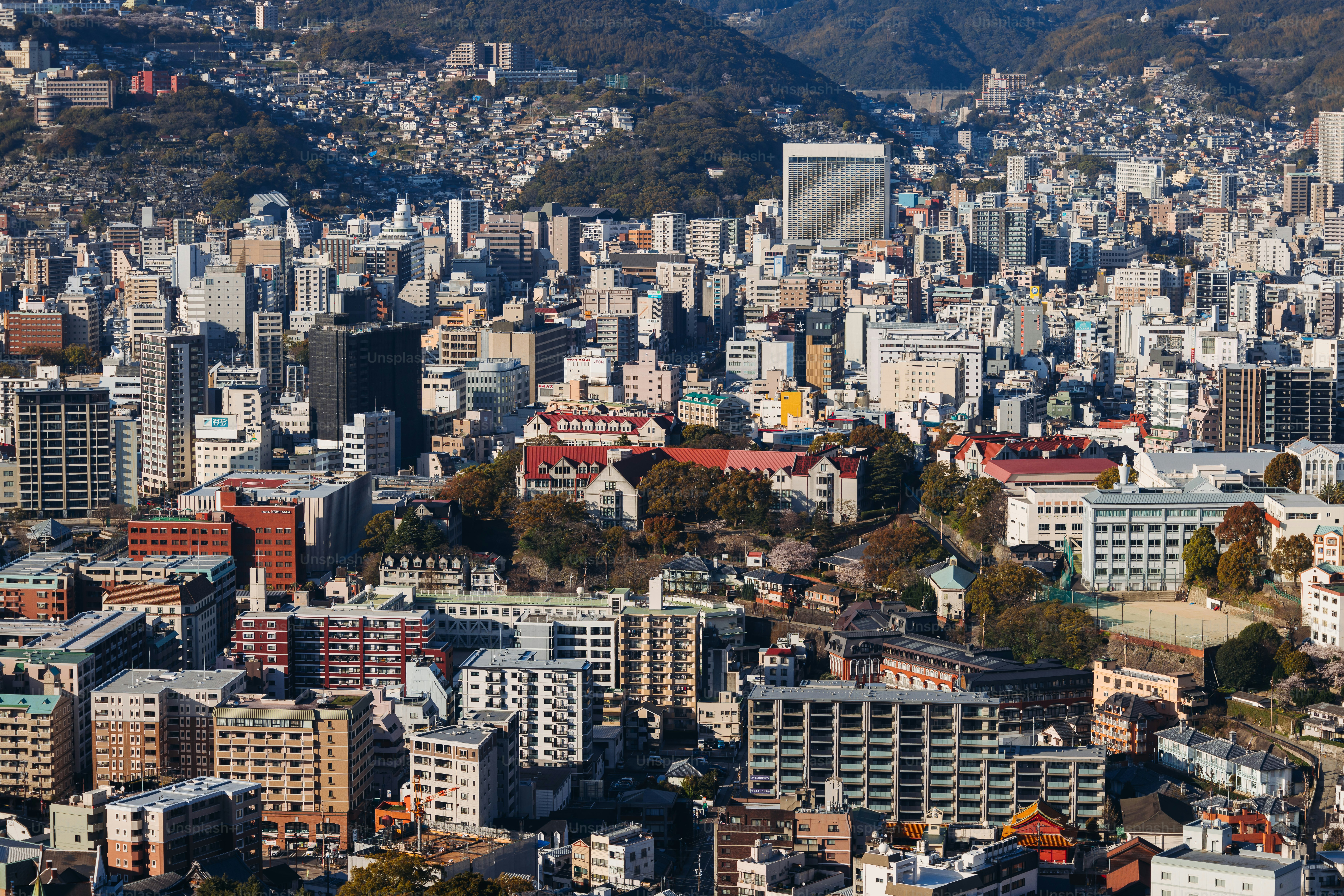 Nagasaki panorama, Japan, beautiful aerial view, with city skyline, port and mountains, seen from Nabekammuri mount, in a spring sunny day with a blue sky, Nagasaki prefecture, Kyushu island region