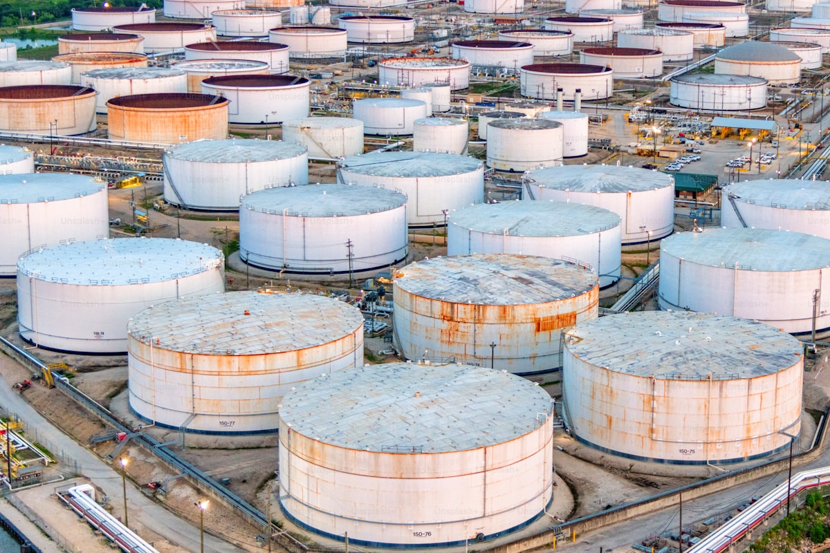 Aerial view of oil refinery storage tanks and industrial infrastructure in Houston, Texas