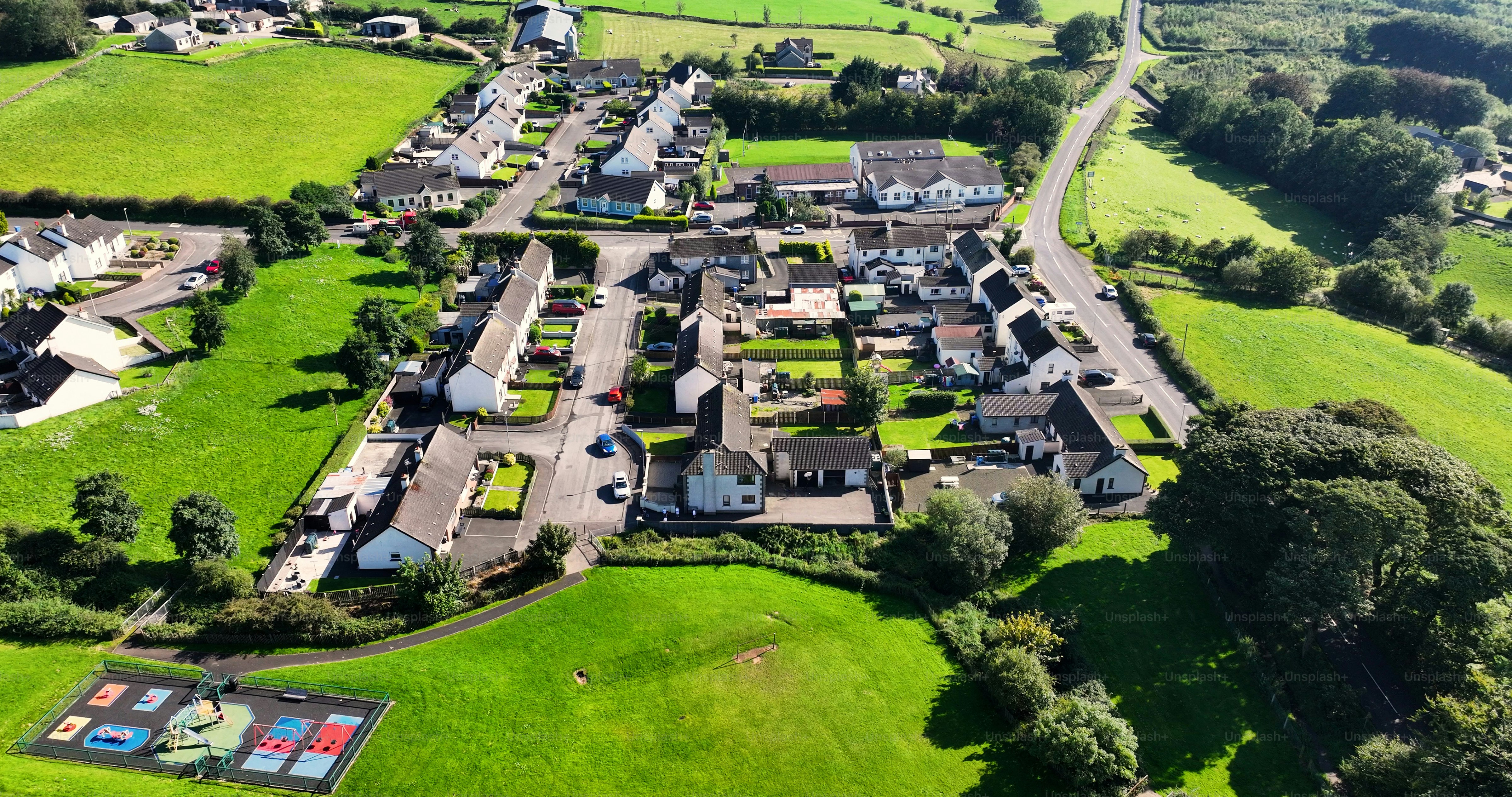 Aerial view of Residential homes, town houses, bungalows, housing, in Corkey village Co Antrim Northern Ireland