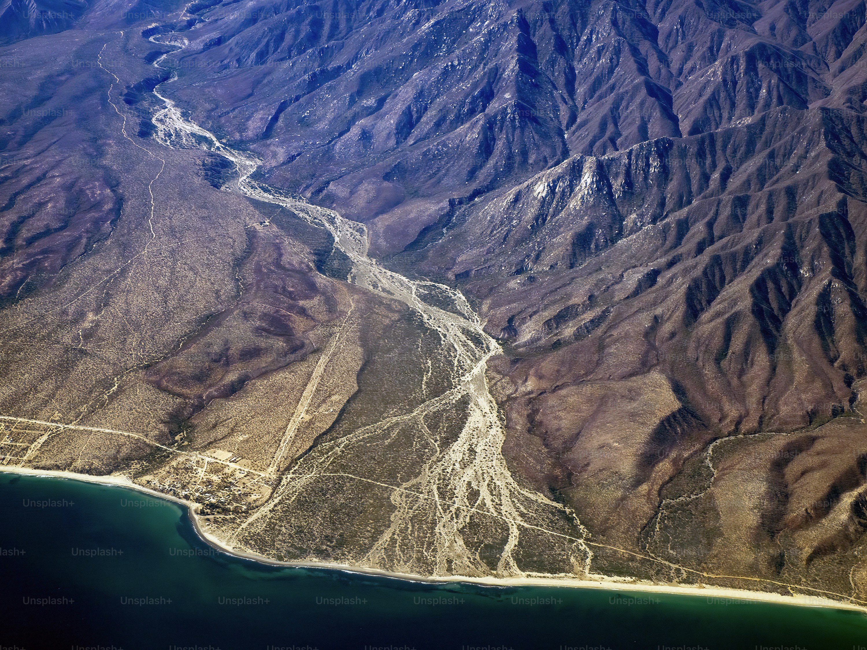 The cabo pulmo baja california sur coast and mountains of sierra Guadalupe aerial view from airplane