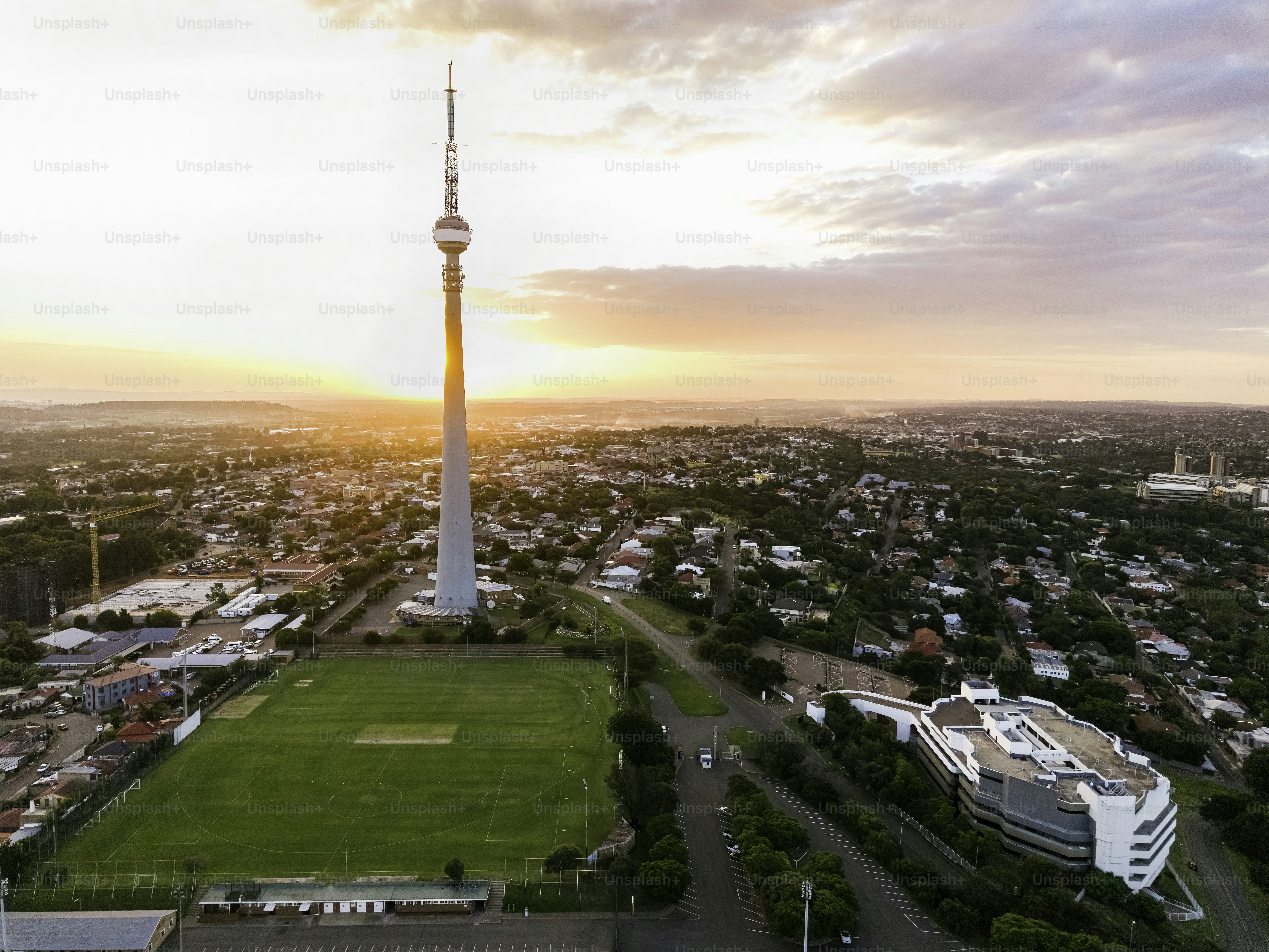 Communications tower sunset with silhouette effect and cloudscape.