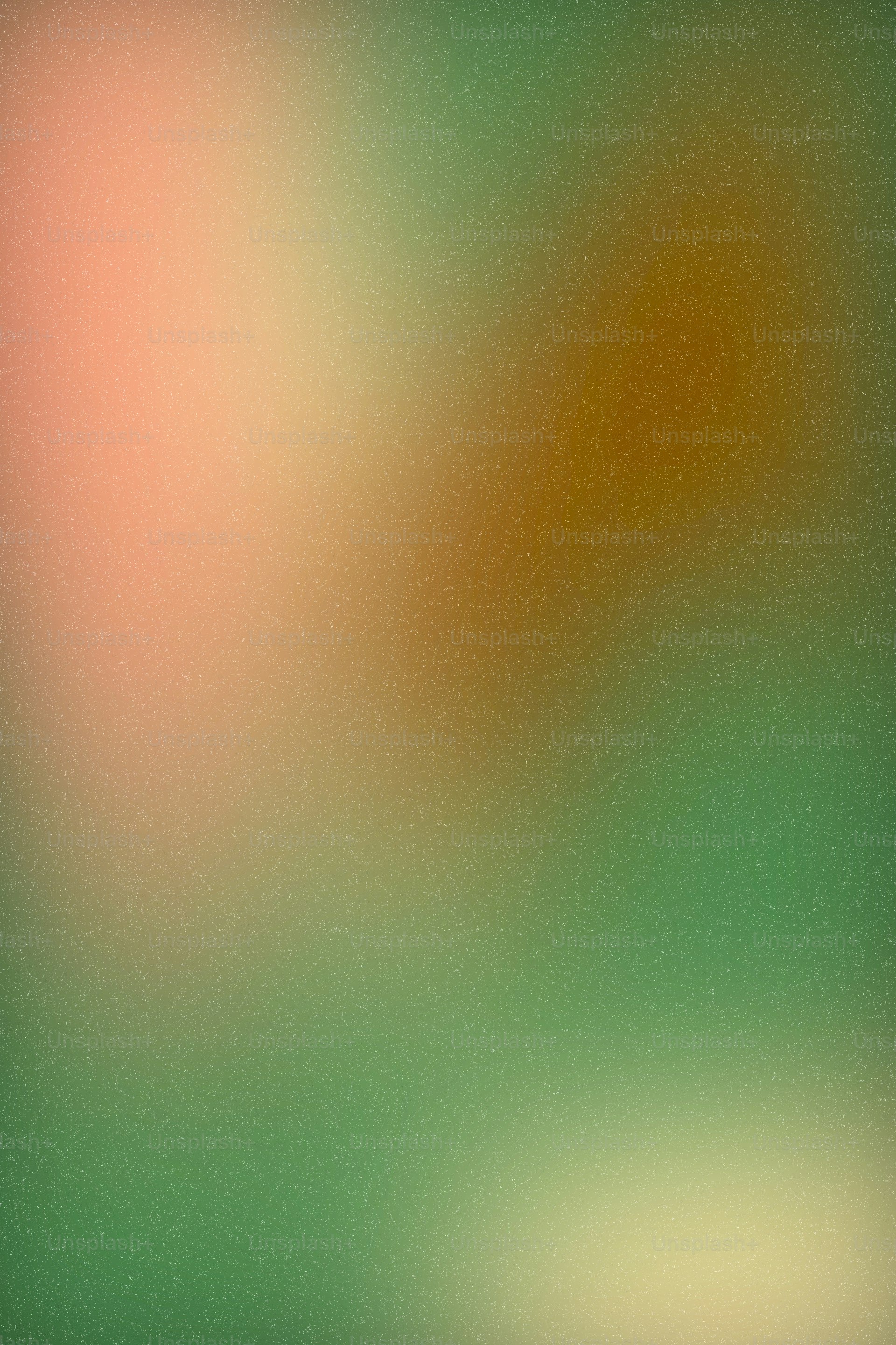 Soft, blended colors of pink, brown, and green.