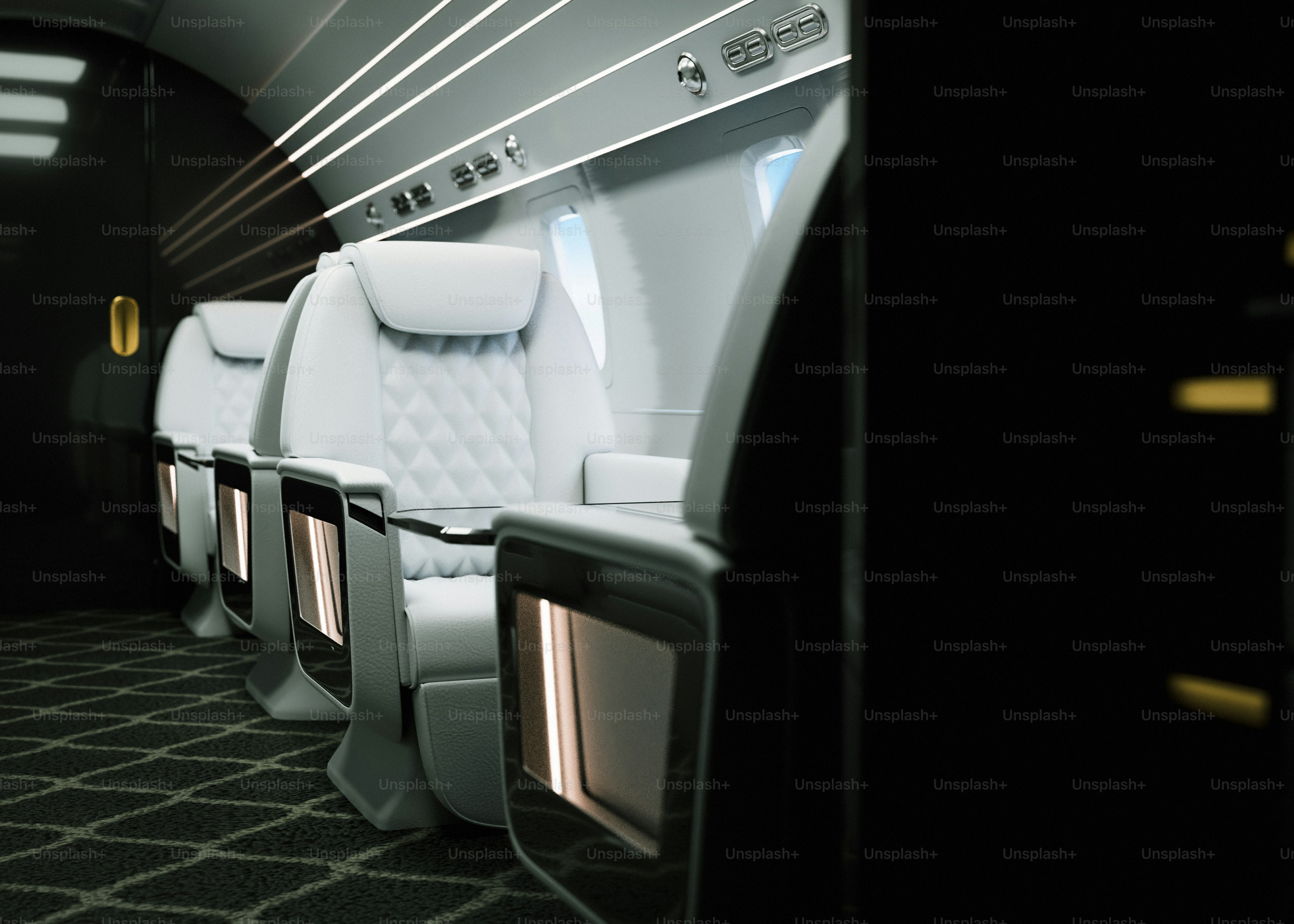 Luxury airplane seats in a modern cabin.