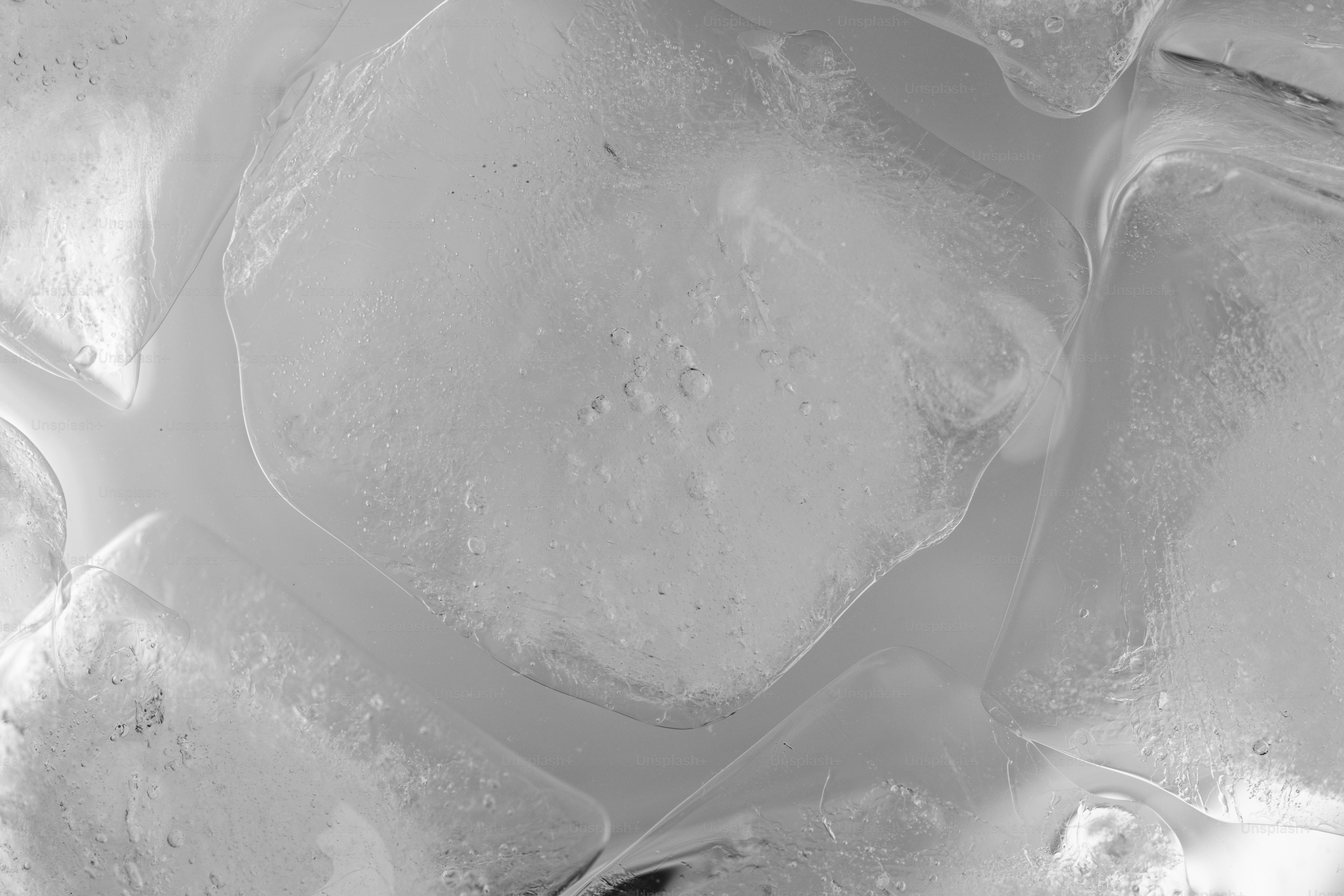 Close-up view of clear, melting ice cubes.
