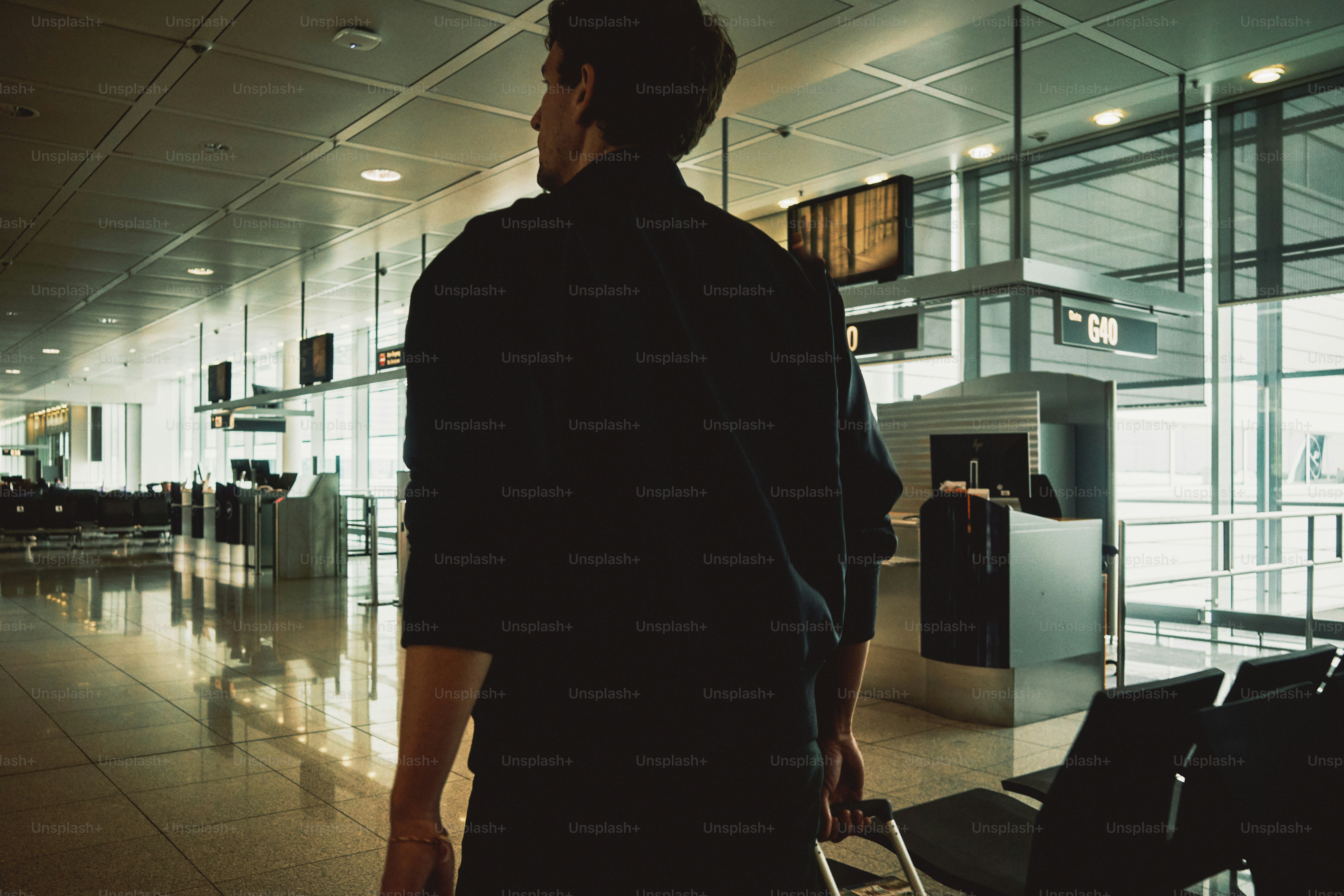 Man walking with luggage at airport photo – Travel Image on Unsplash