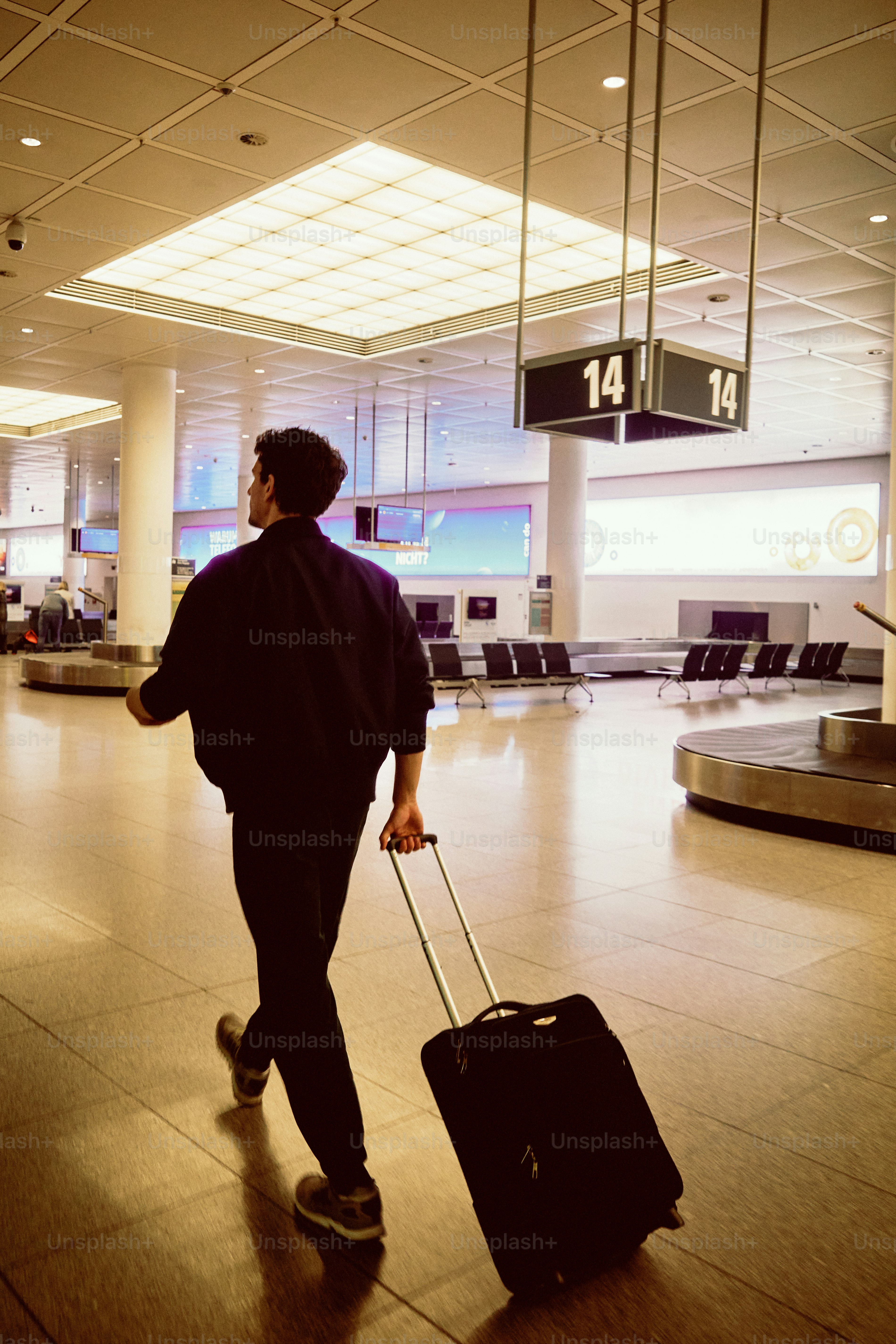Man walking with luggage at airport