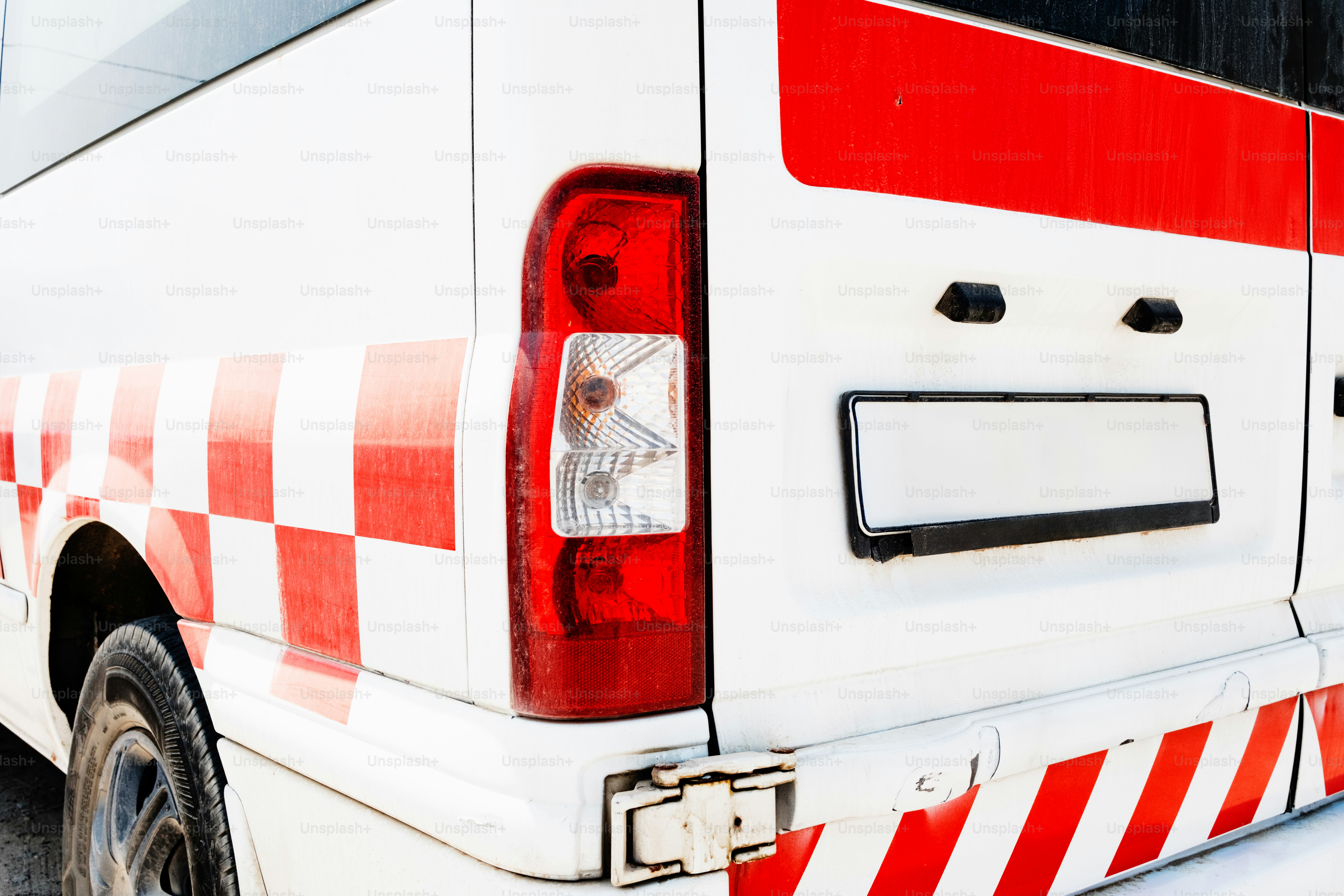 White van with red and white checkered pattern