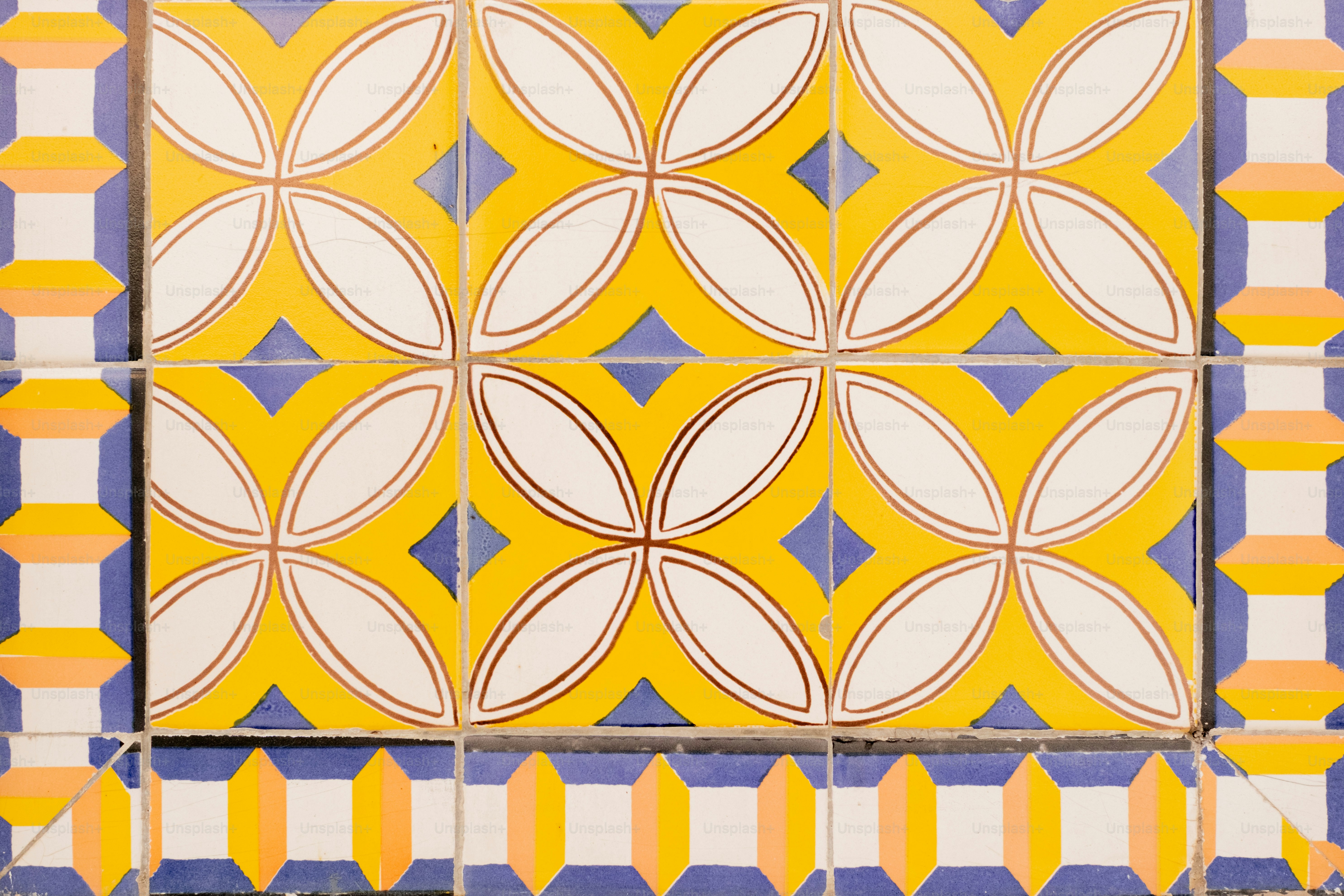 Yellow and white geometric pattern tiles with blue accents