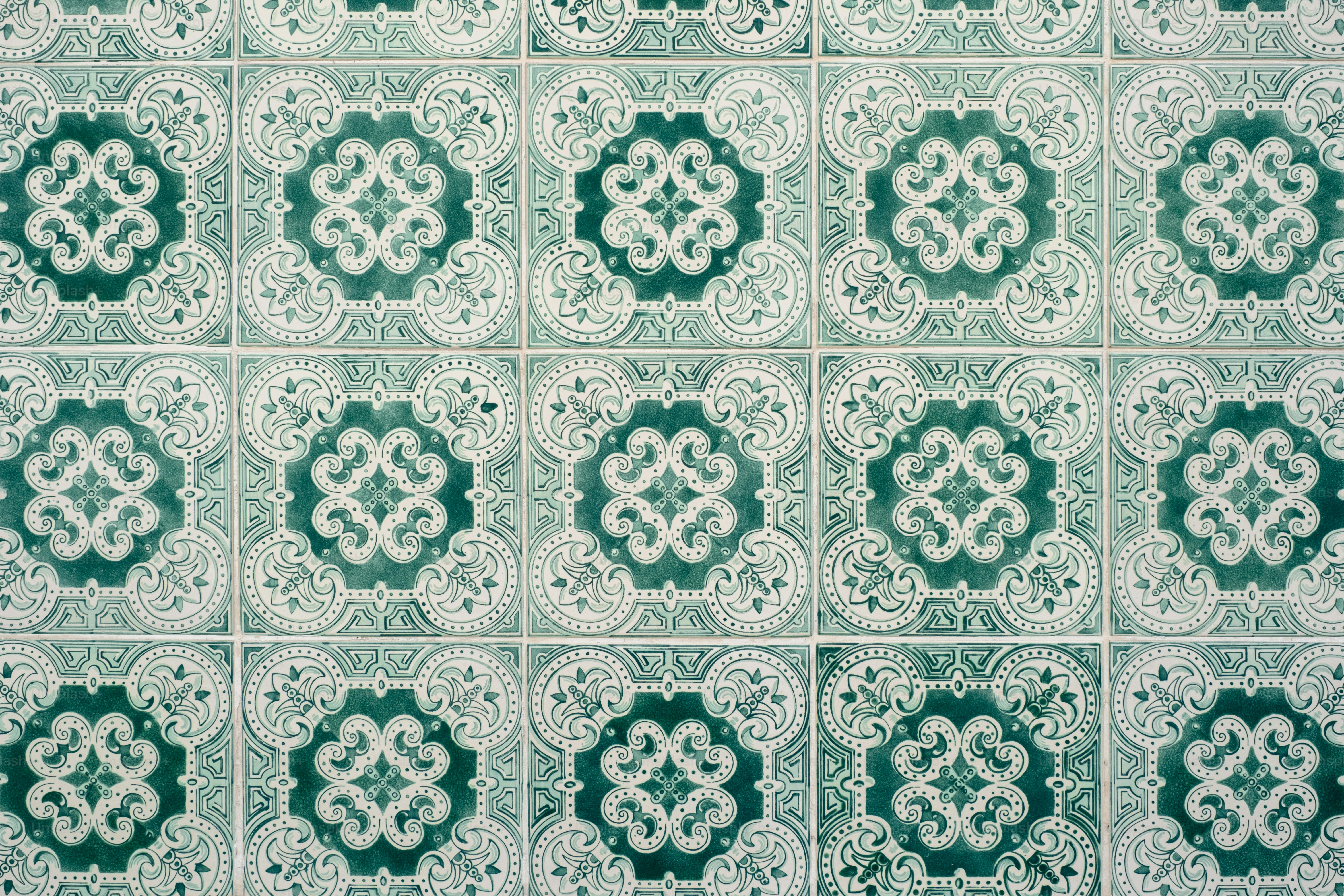 Green and white geometric pattern on tiles