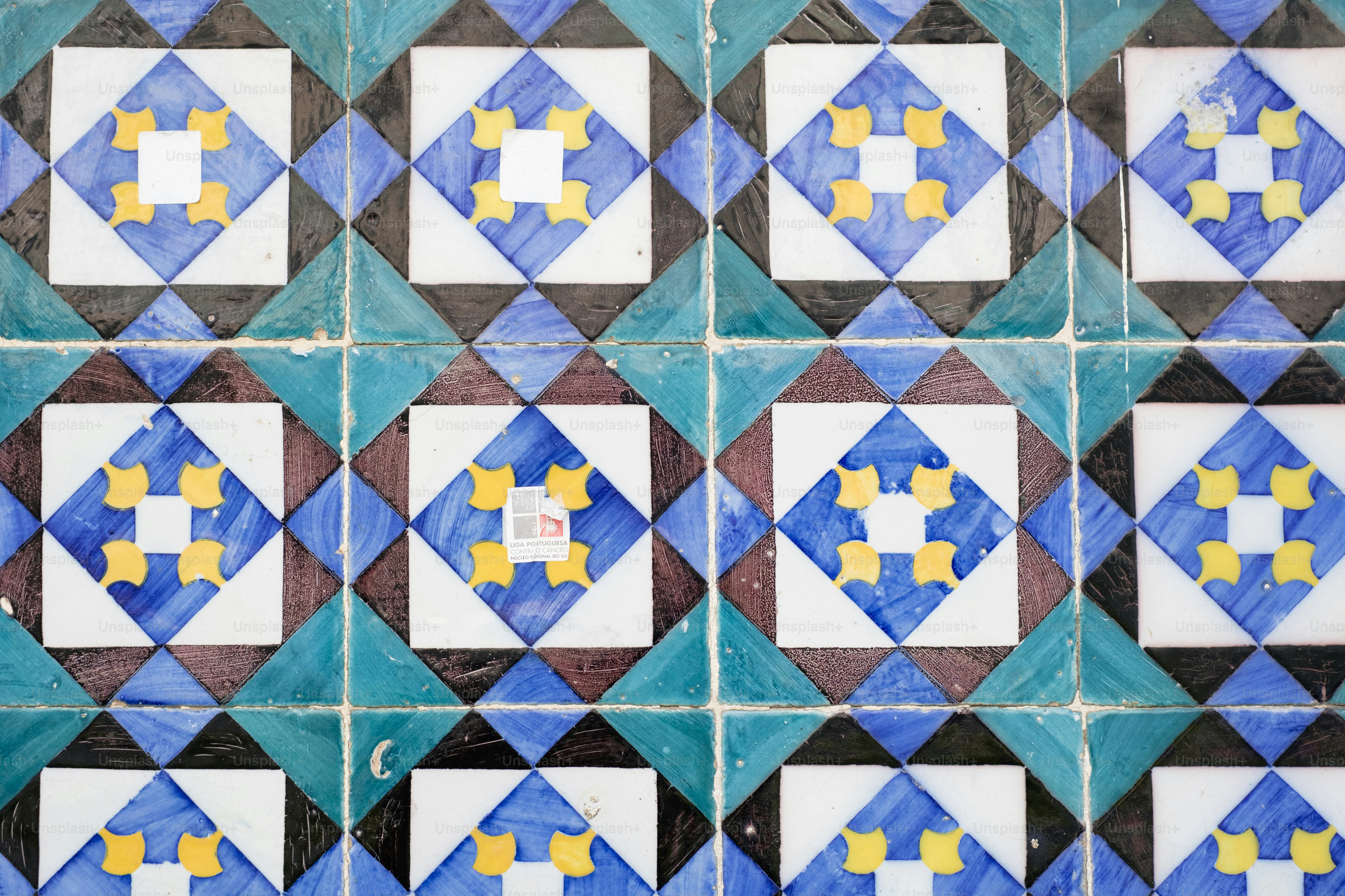Blue and green geometric tiles with diamond patterns