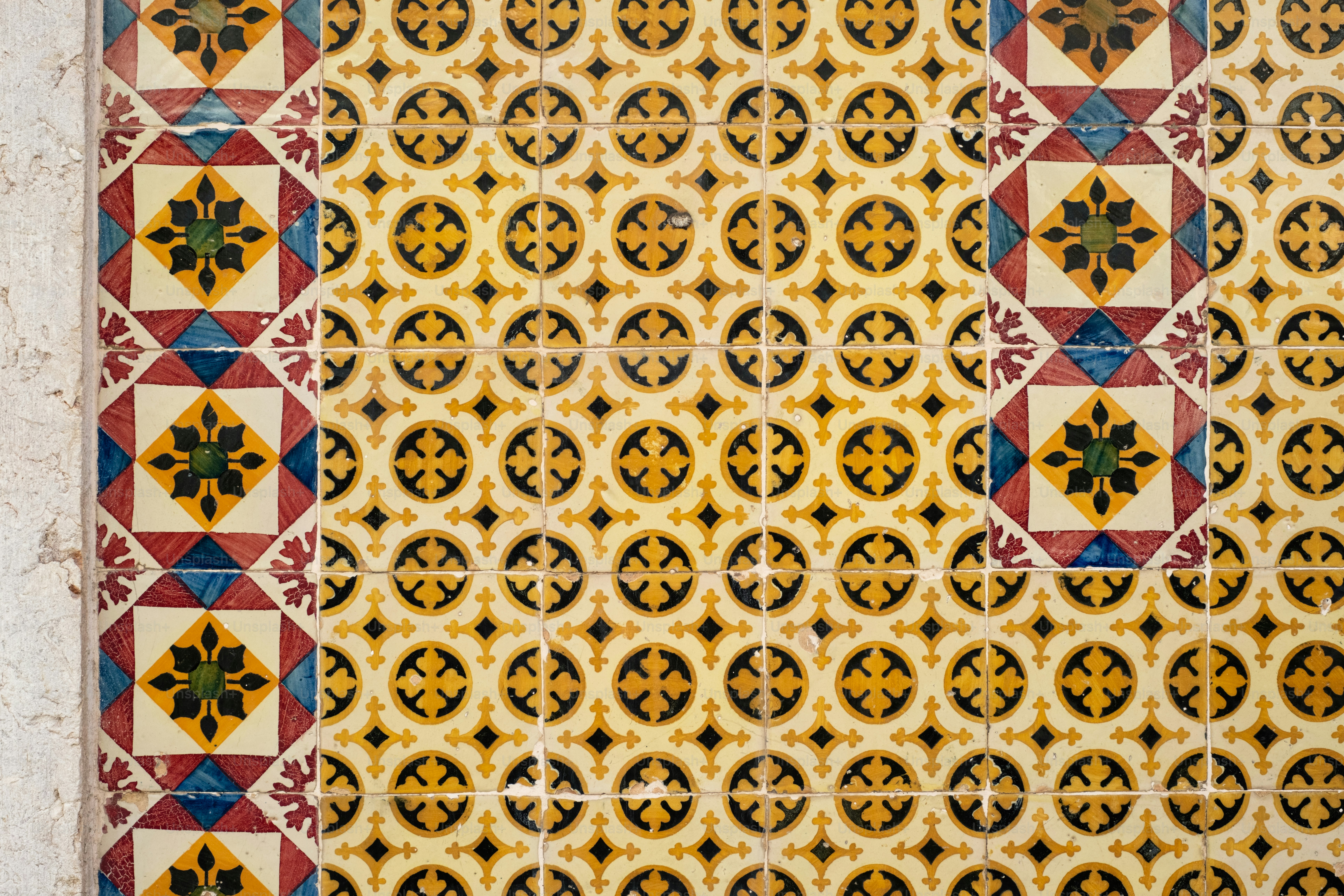 Intricate geometric tile pattern in yellow and brown