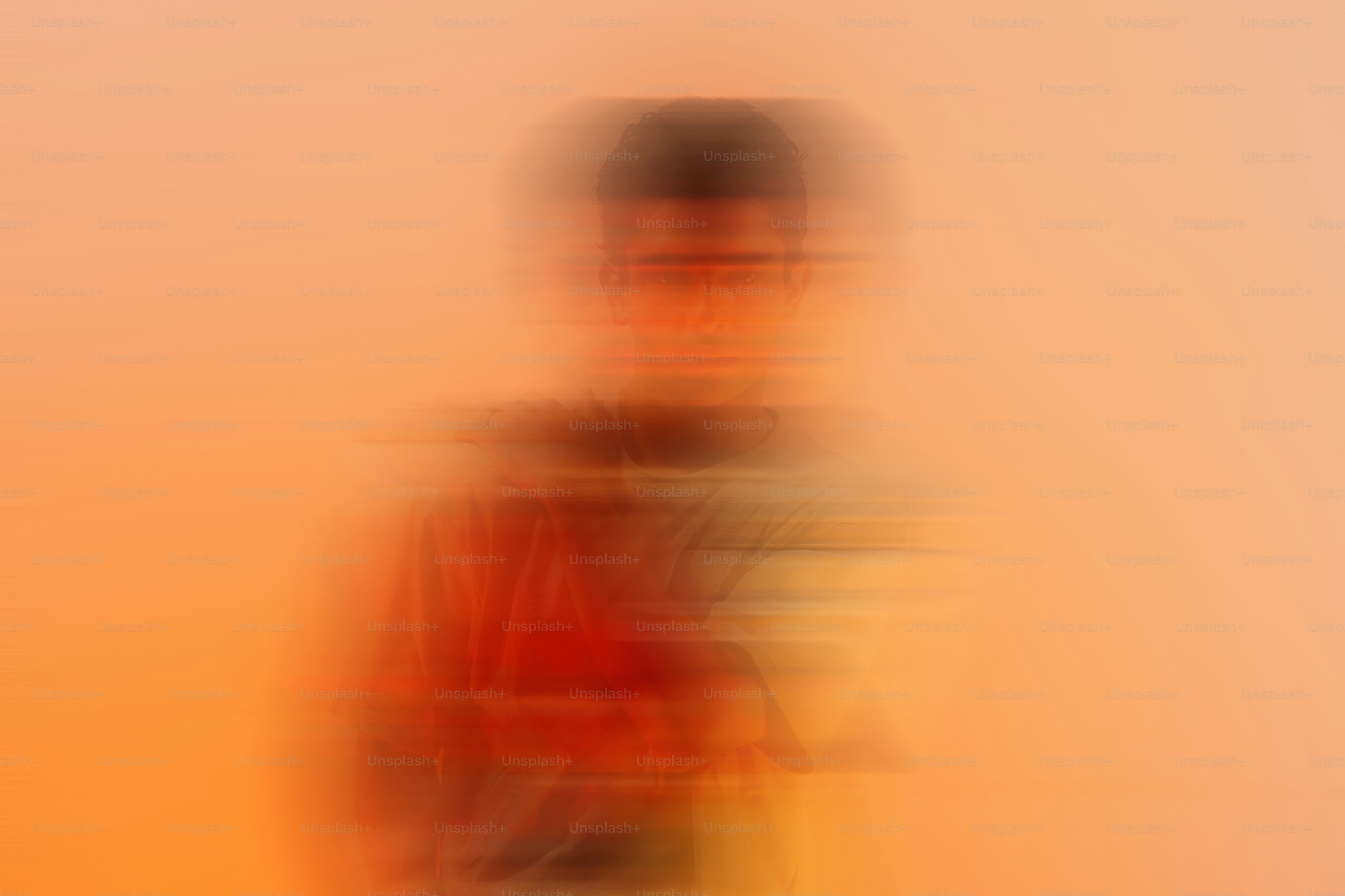 Blurred figure wearing a colorful hooded sweatshirt