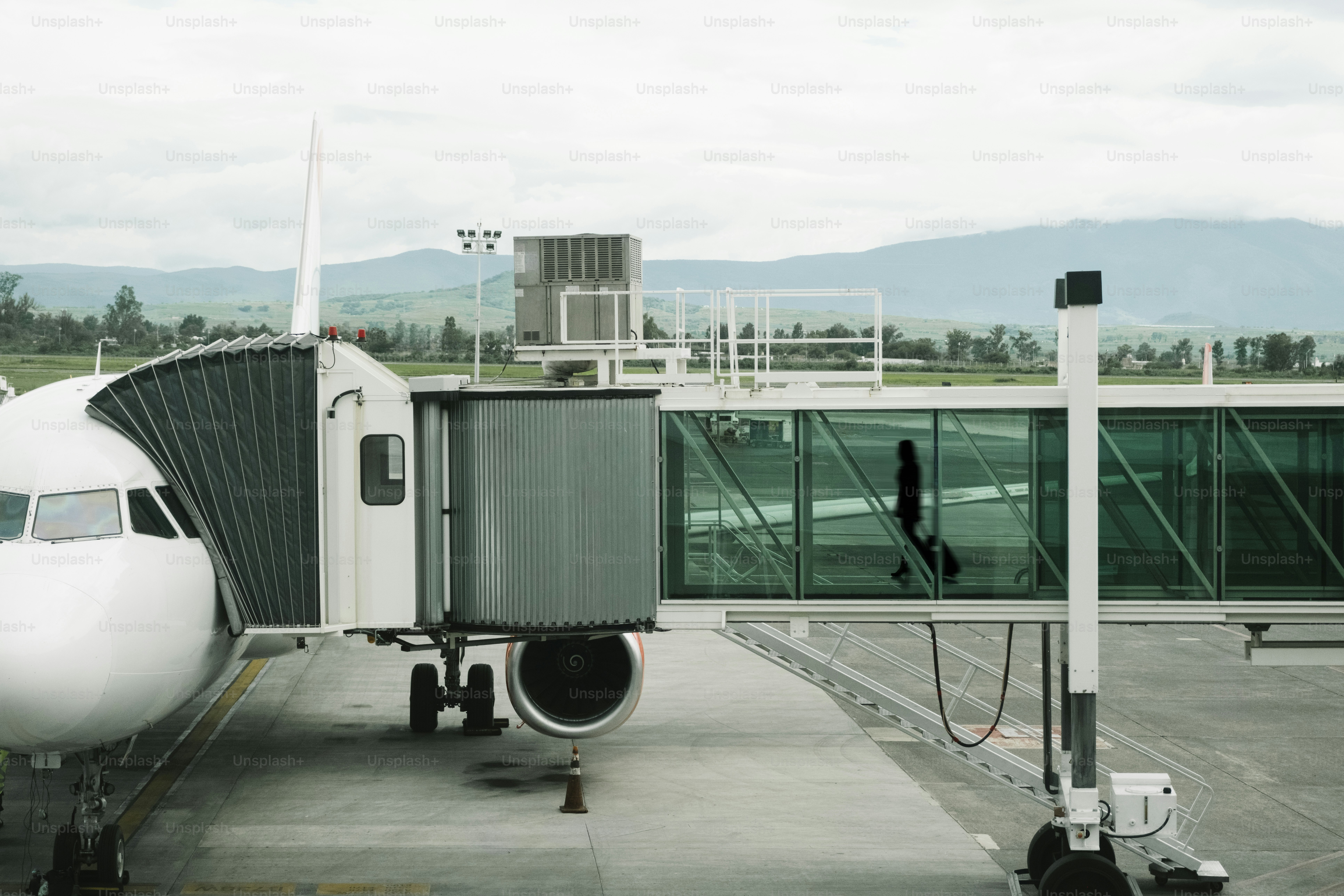 Airplane connected to a jet bridge at airport
