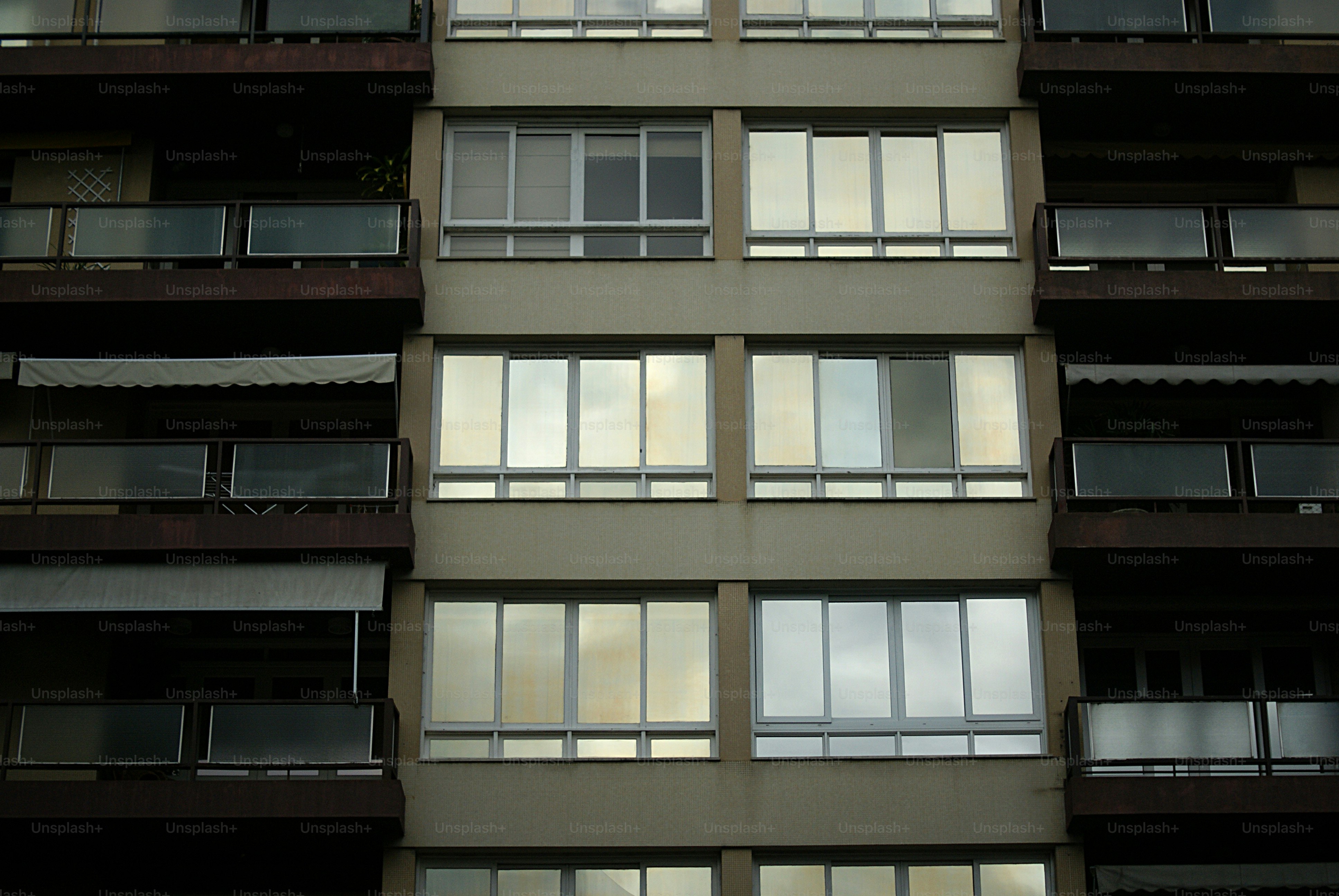Modern building facade with reflective windows and balconies