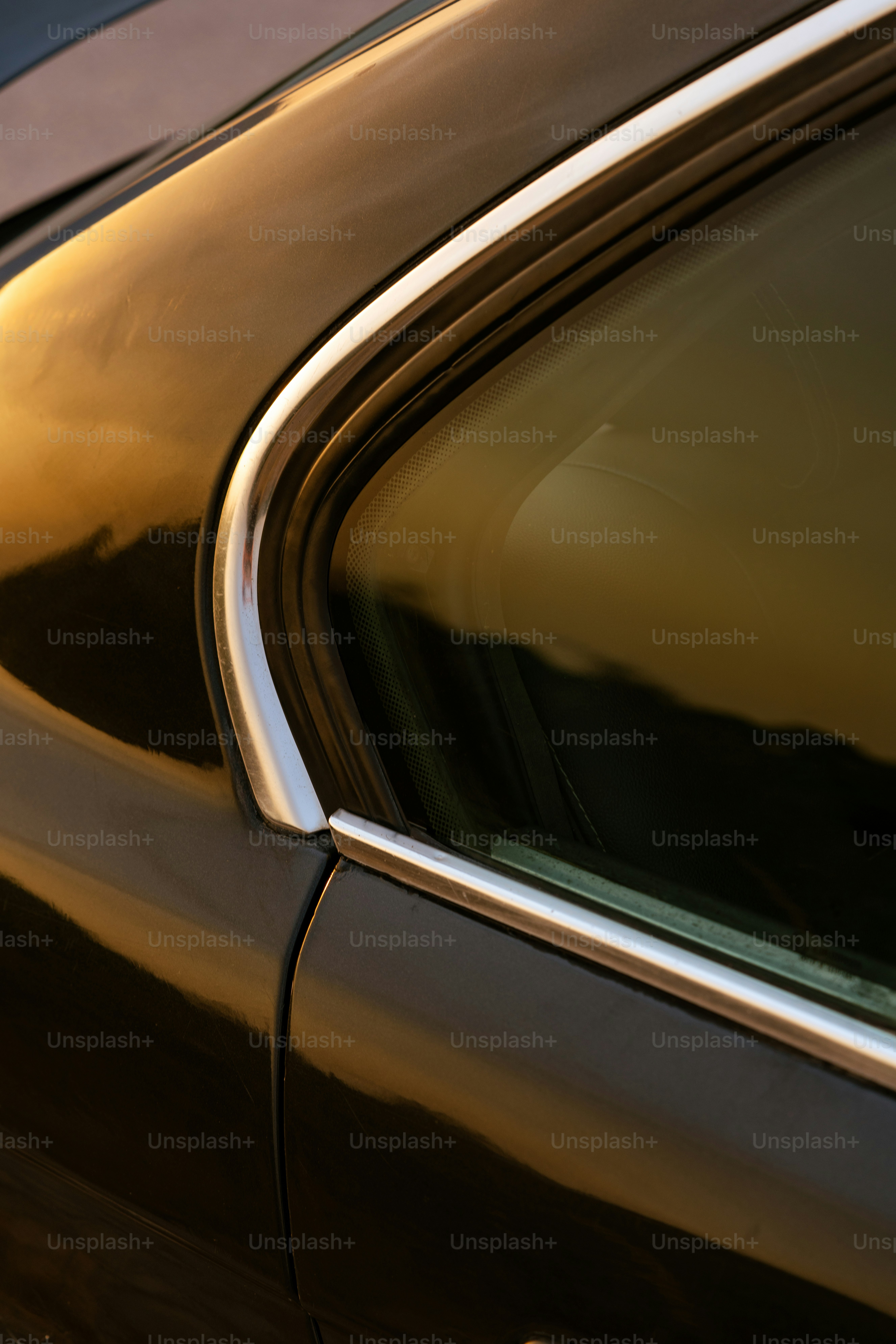 Close-up of a car window reflecting sunset colors photo – Moody Image ...