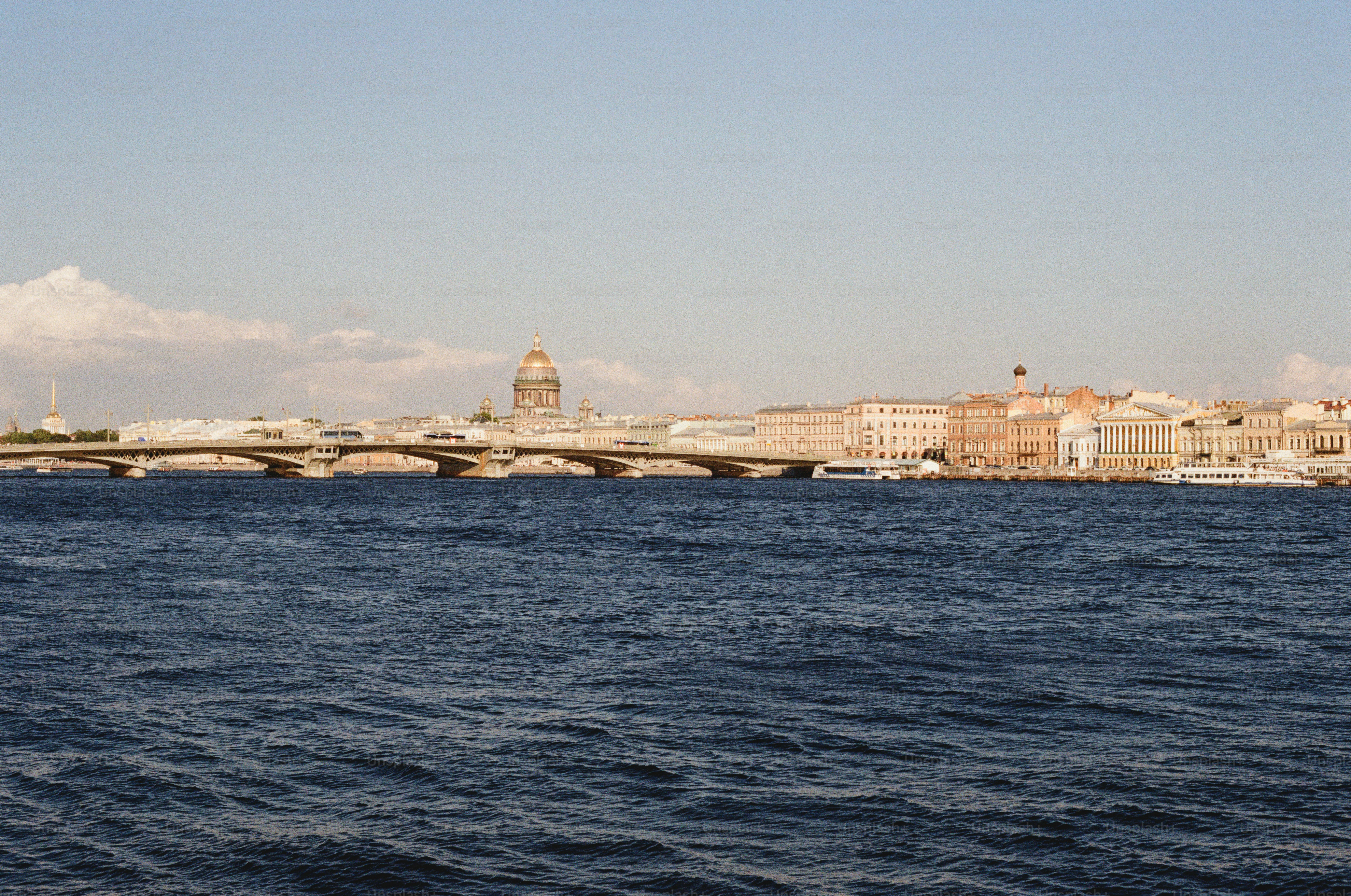 City skyline with bridge over river on a clear day