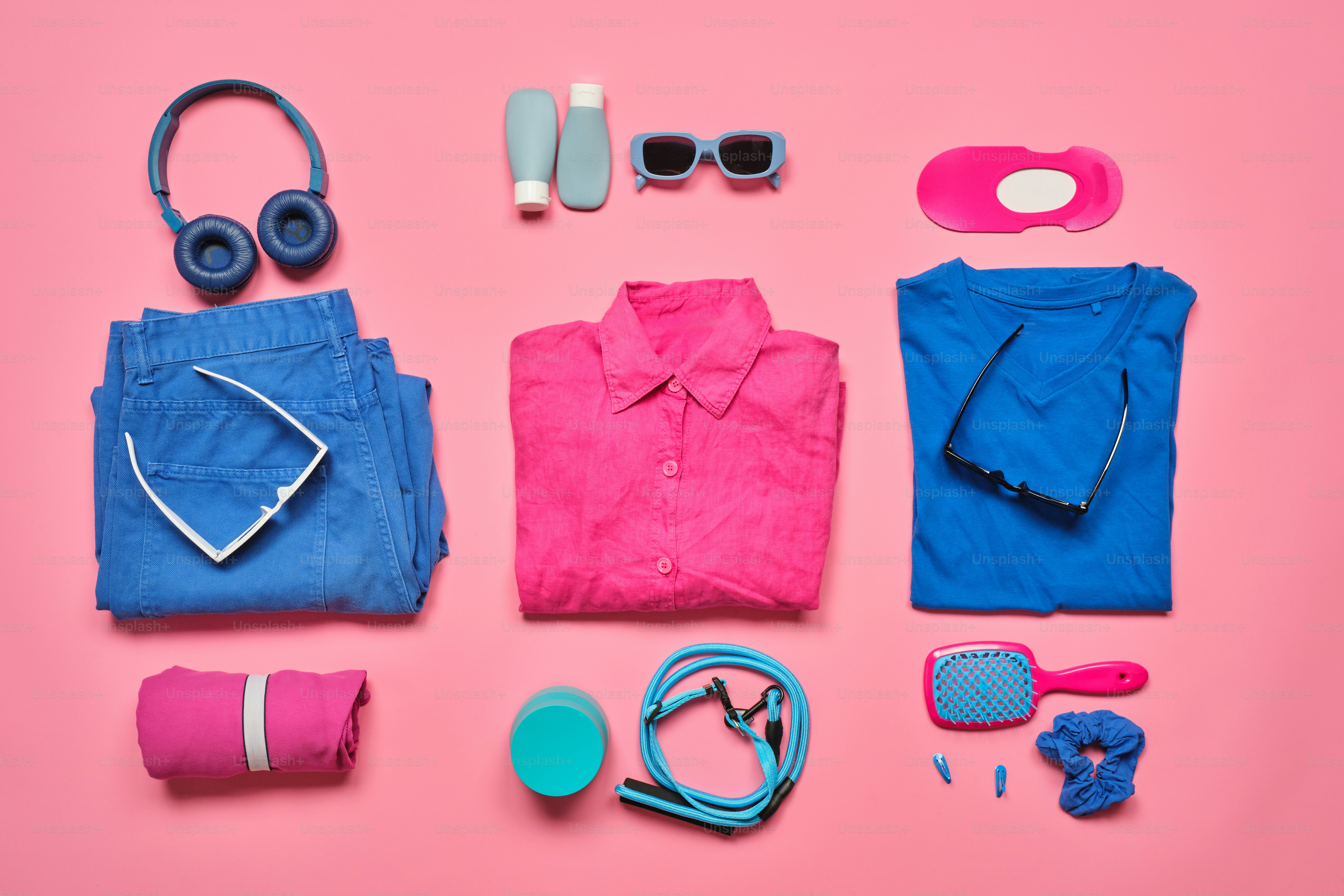 Flat lay of travel essentials and clothing items