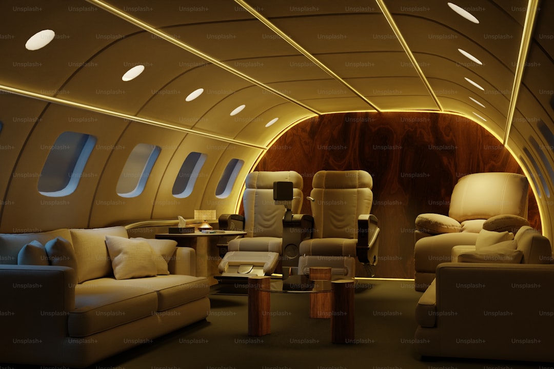 Luxurious private jet interior with plush seating and lighting