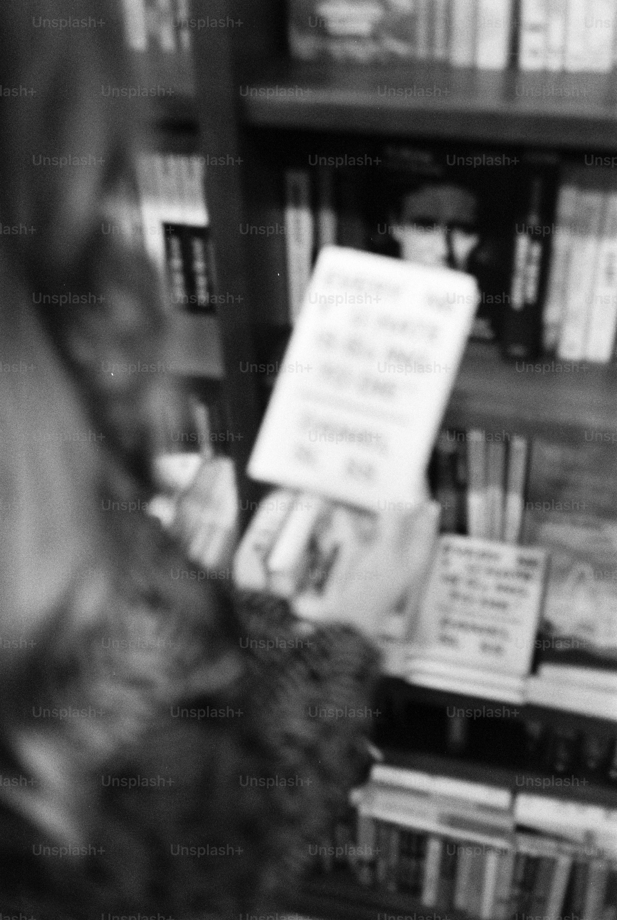 Person holding a book in a library