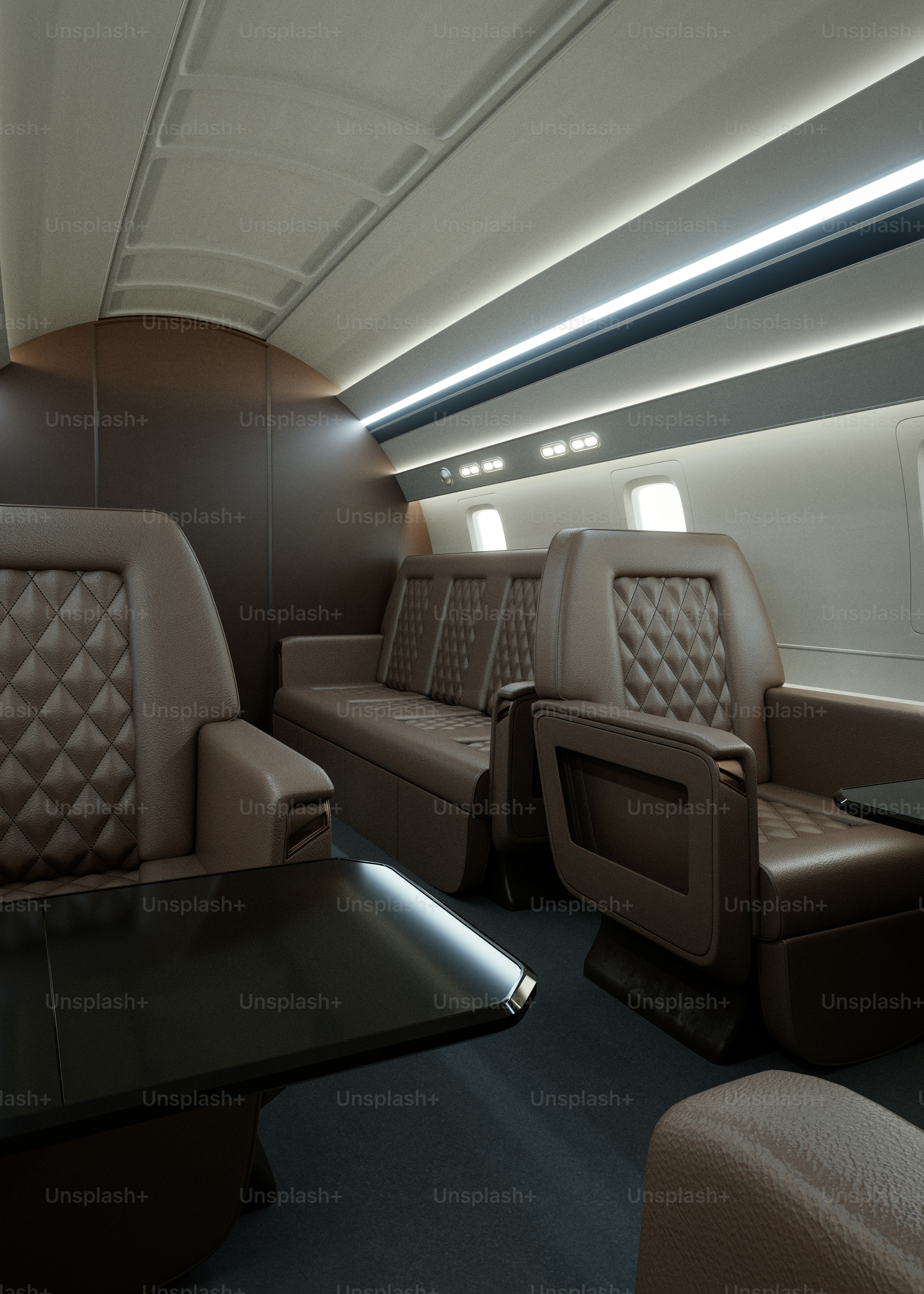 Luxurious private jet interior with leather seating and lighting.