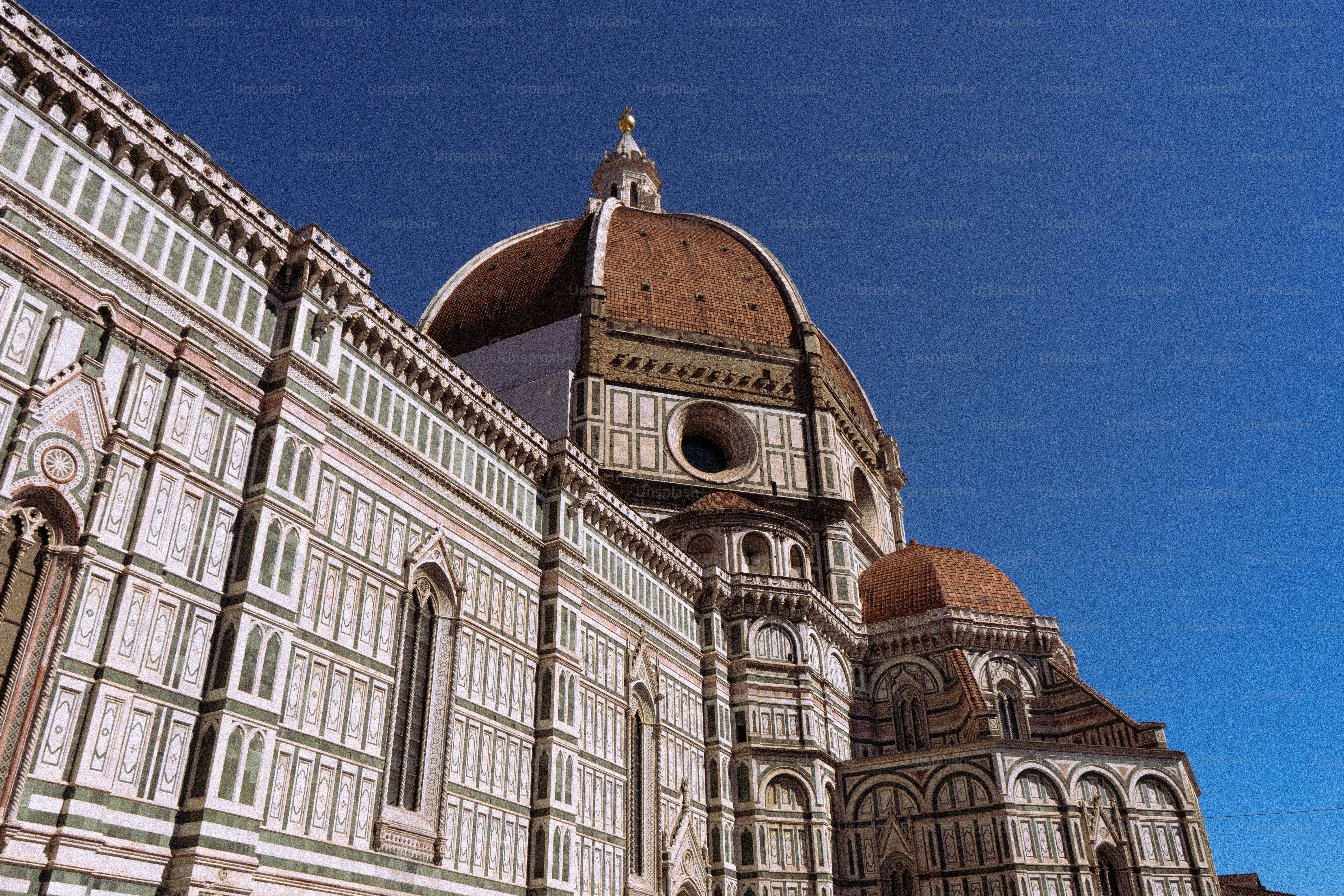 Historic cathedral dome against a clear blue sky