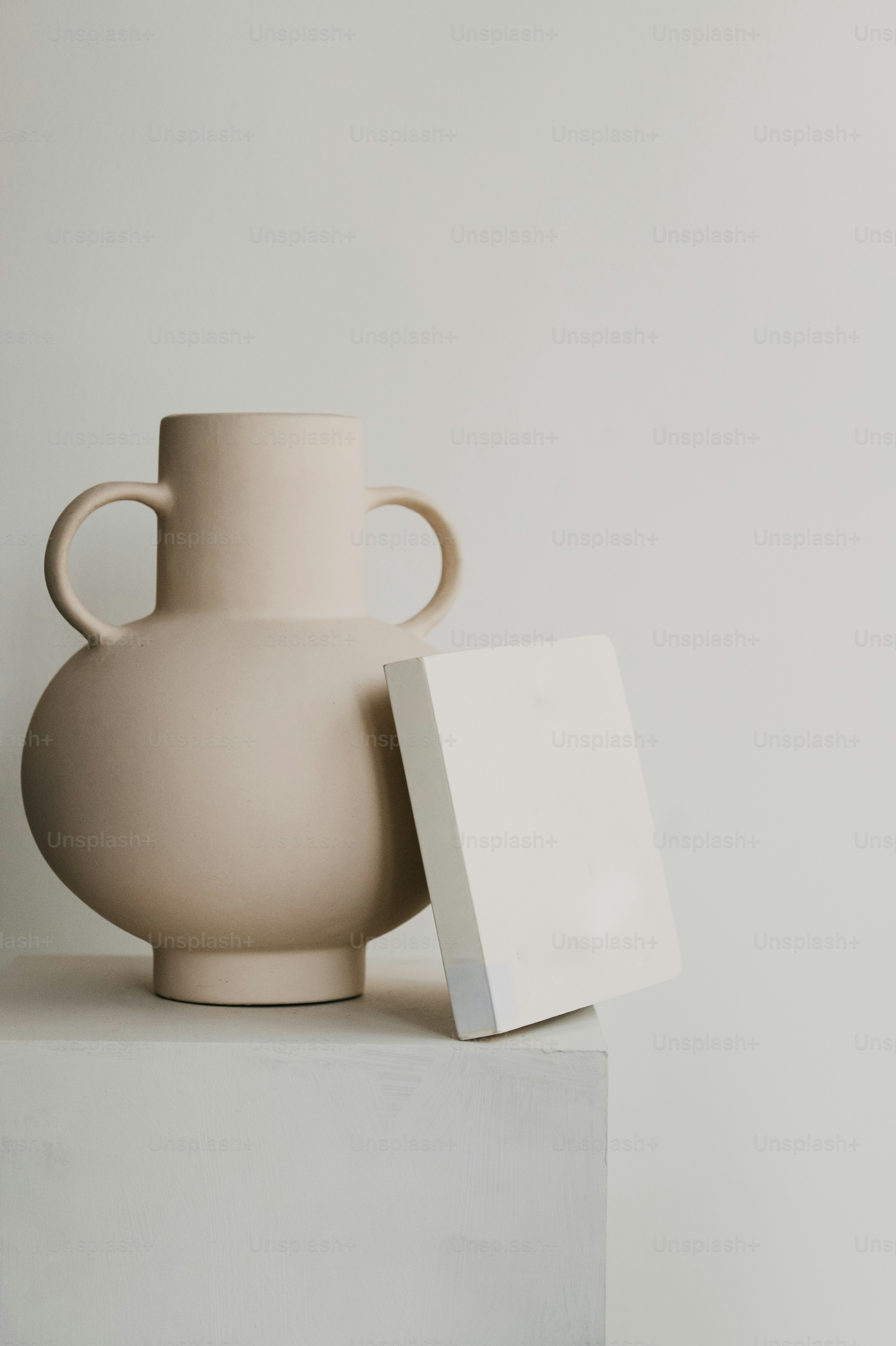 Ceramic vase on stack of books