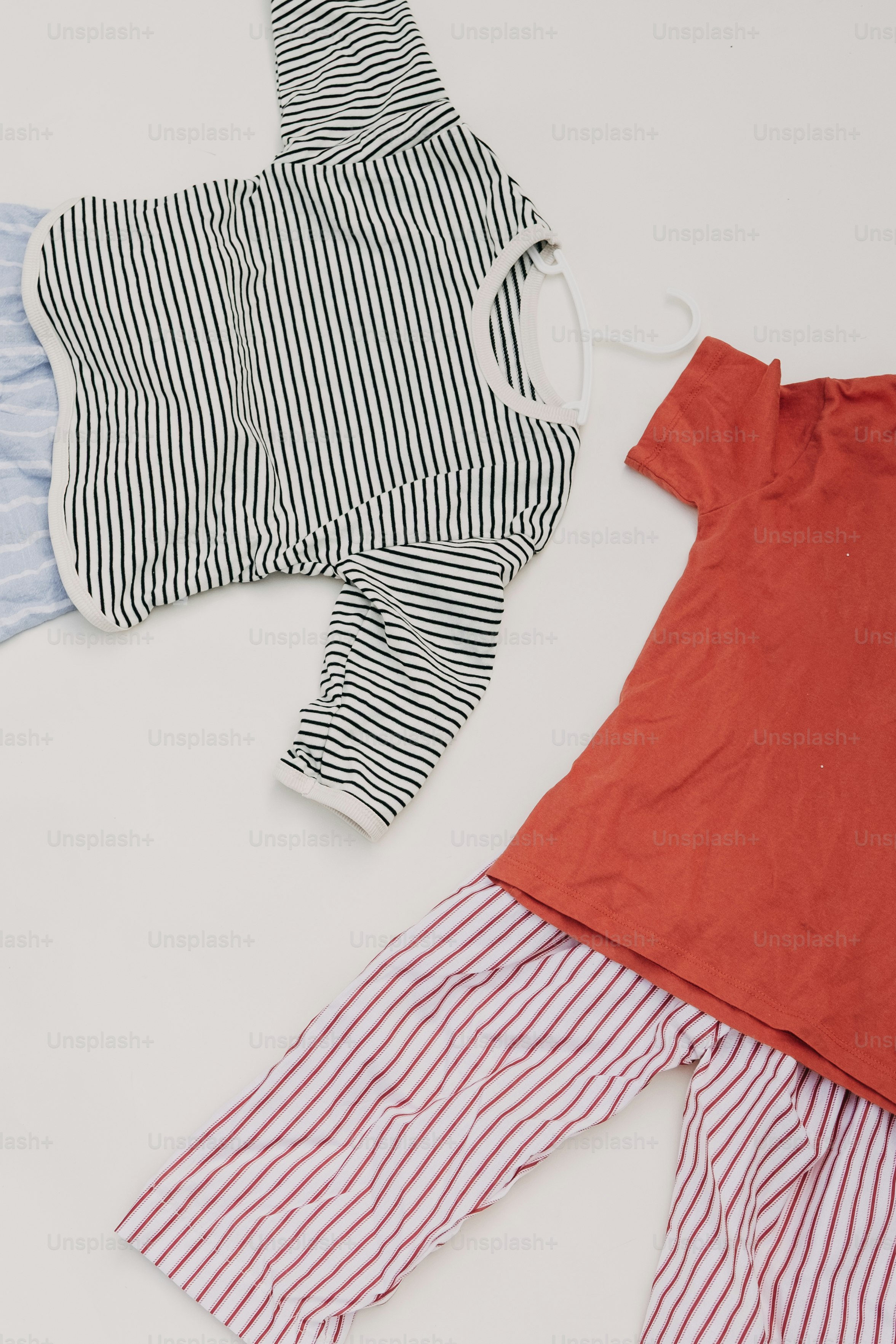 Striped and red clothing laid out flat