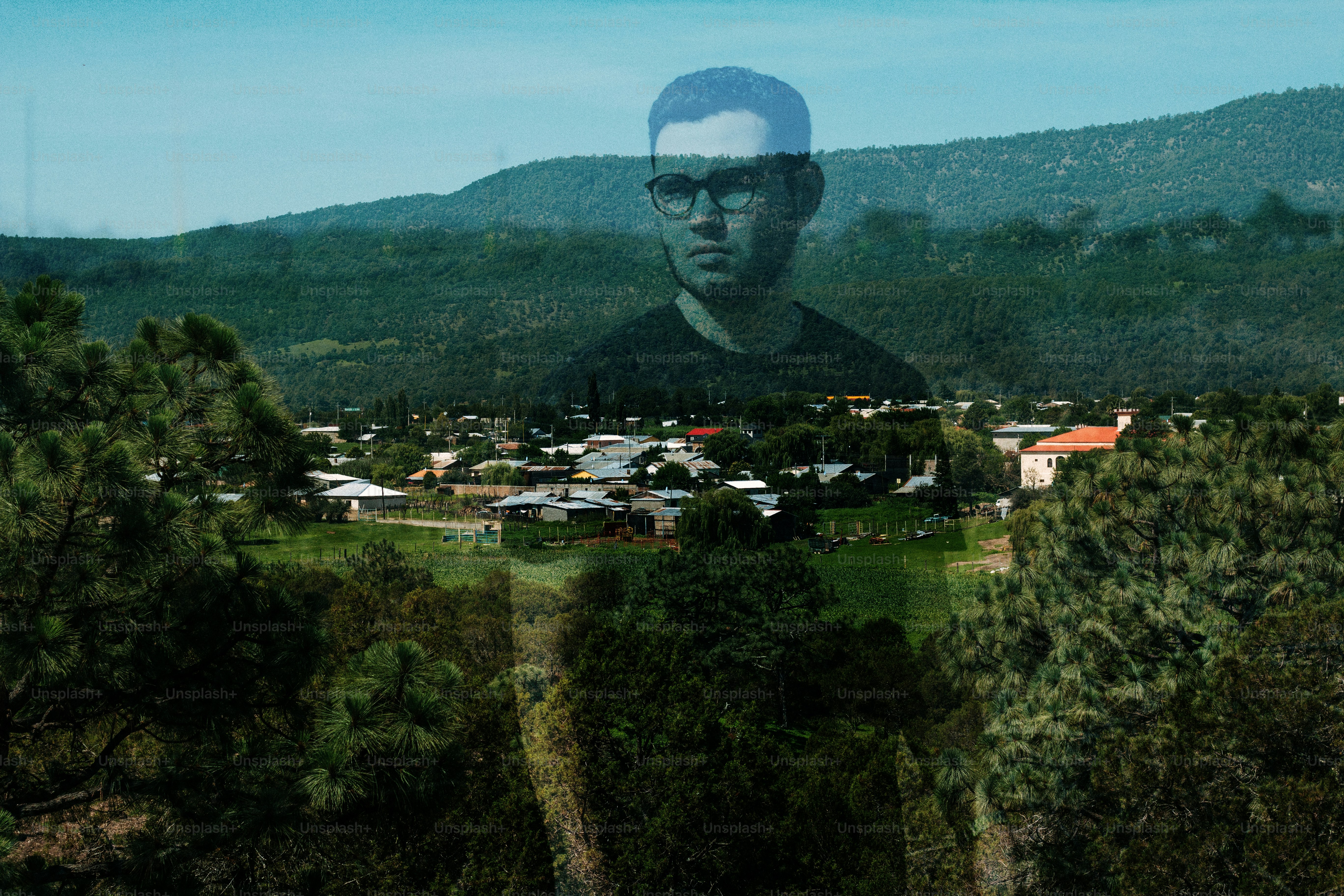 Man superimposed over rural town and landscape