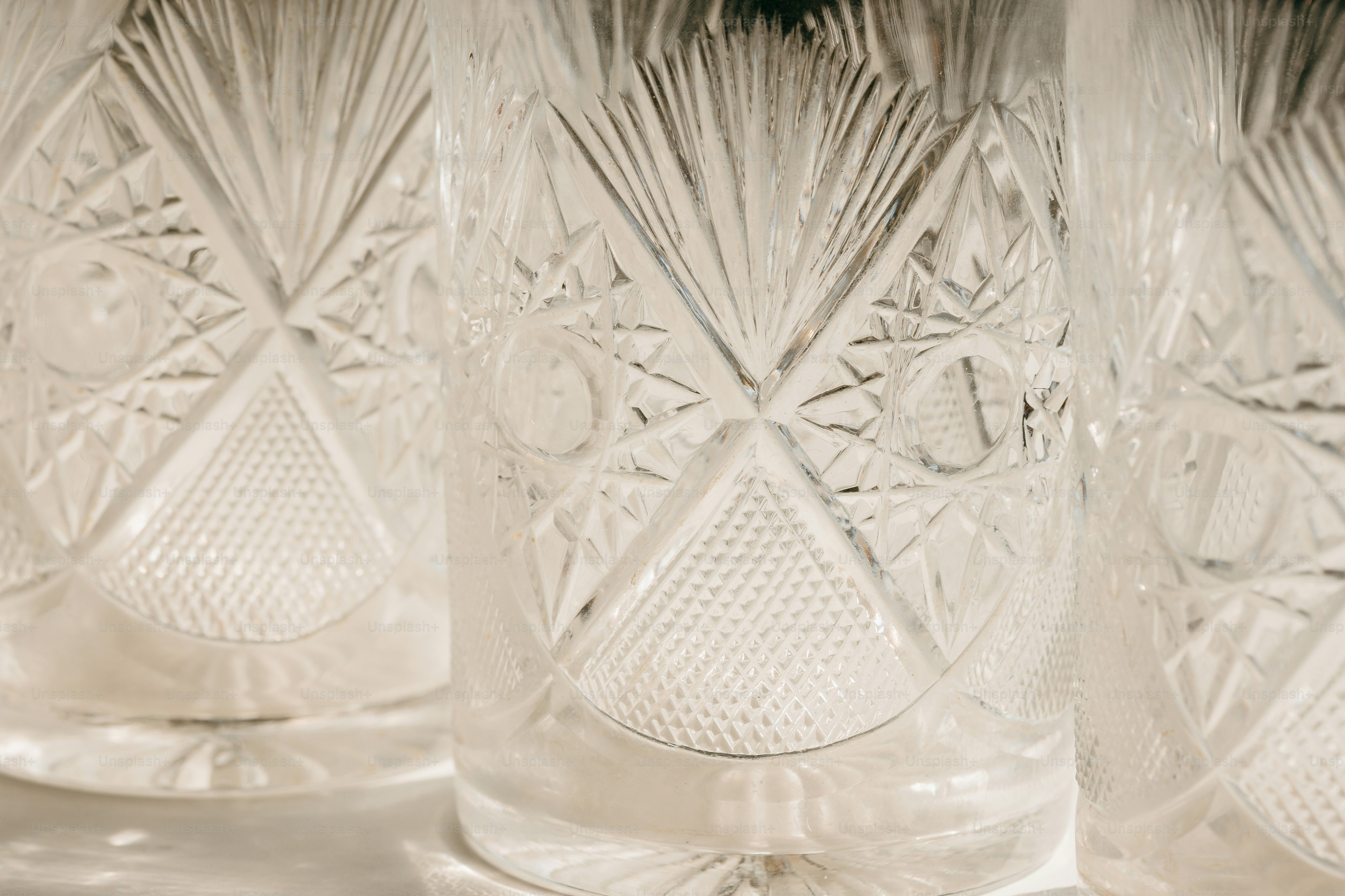 Close up of three ornate crystal glasses