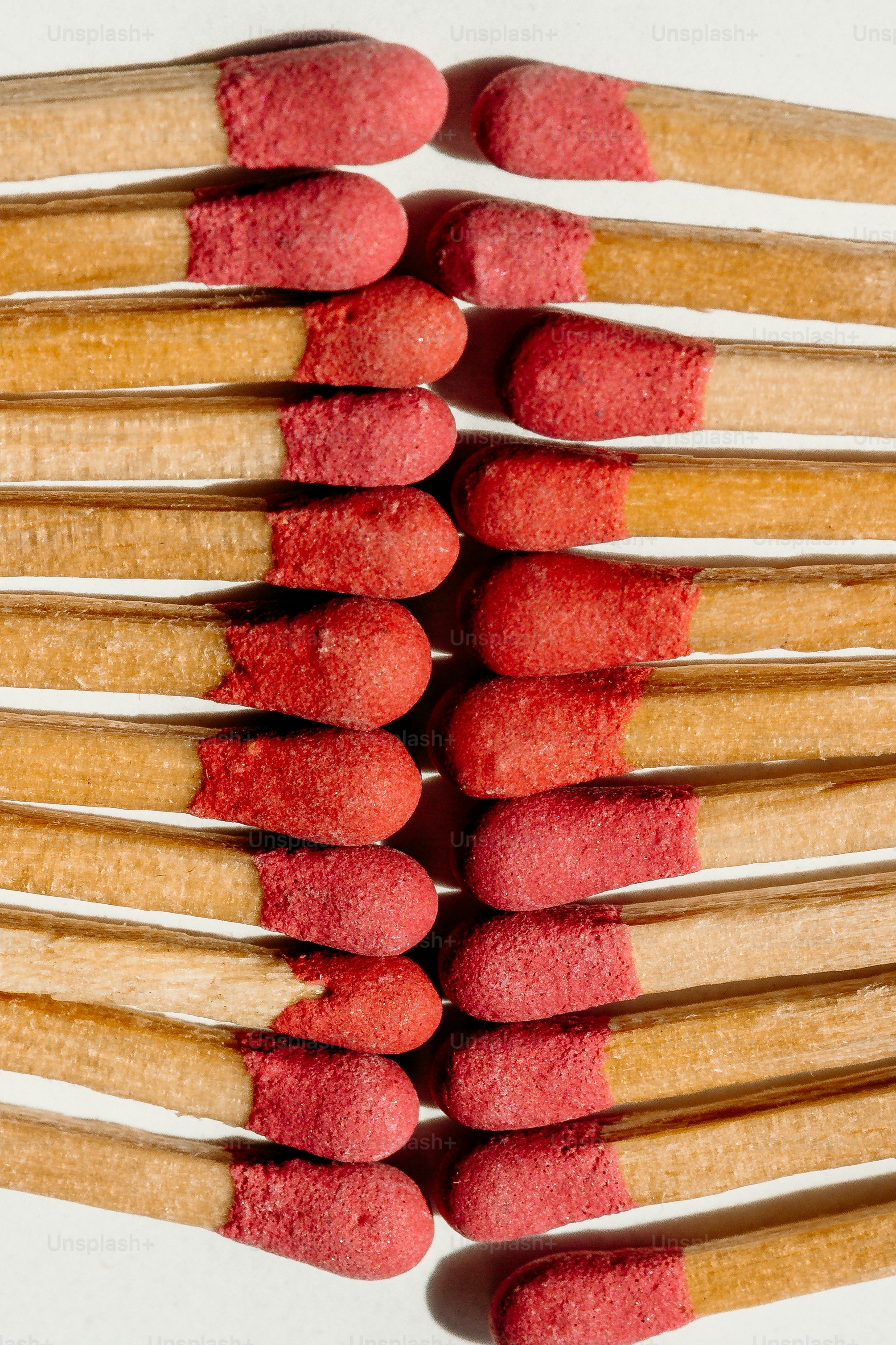 Several red-tipped matches arranged in rows photo – Texture Image on ...