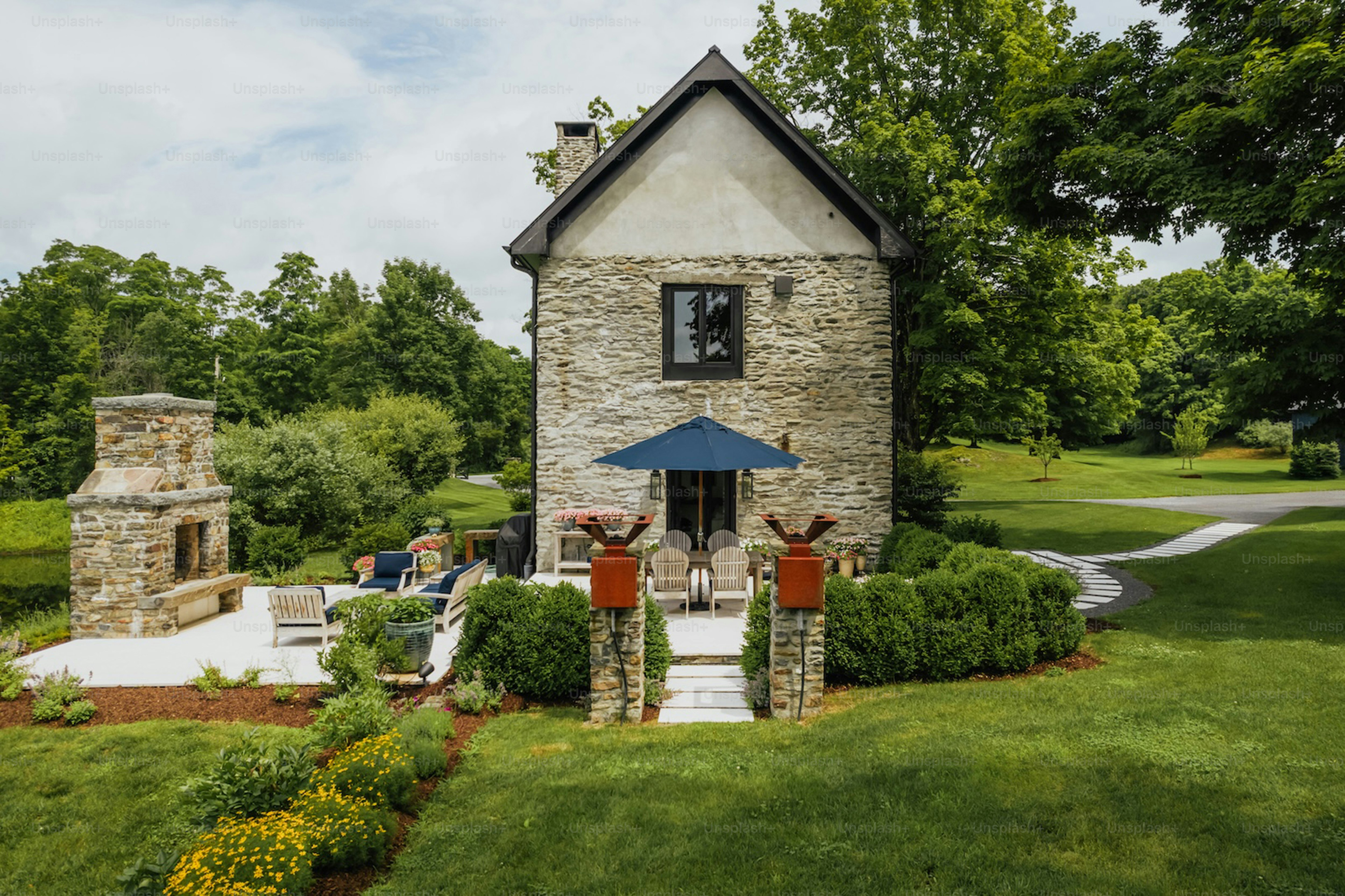 Stone cottage with patio and outdoor fireplace