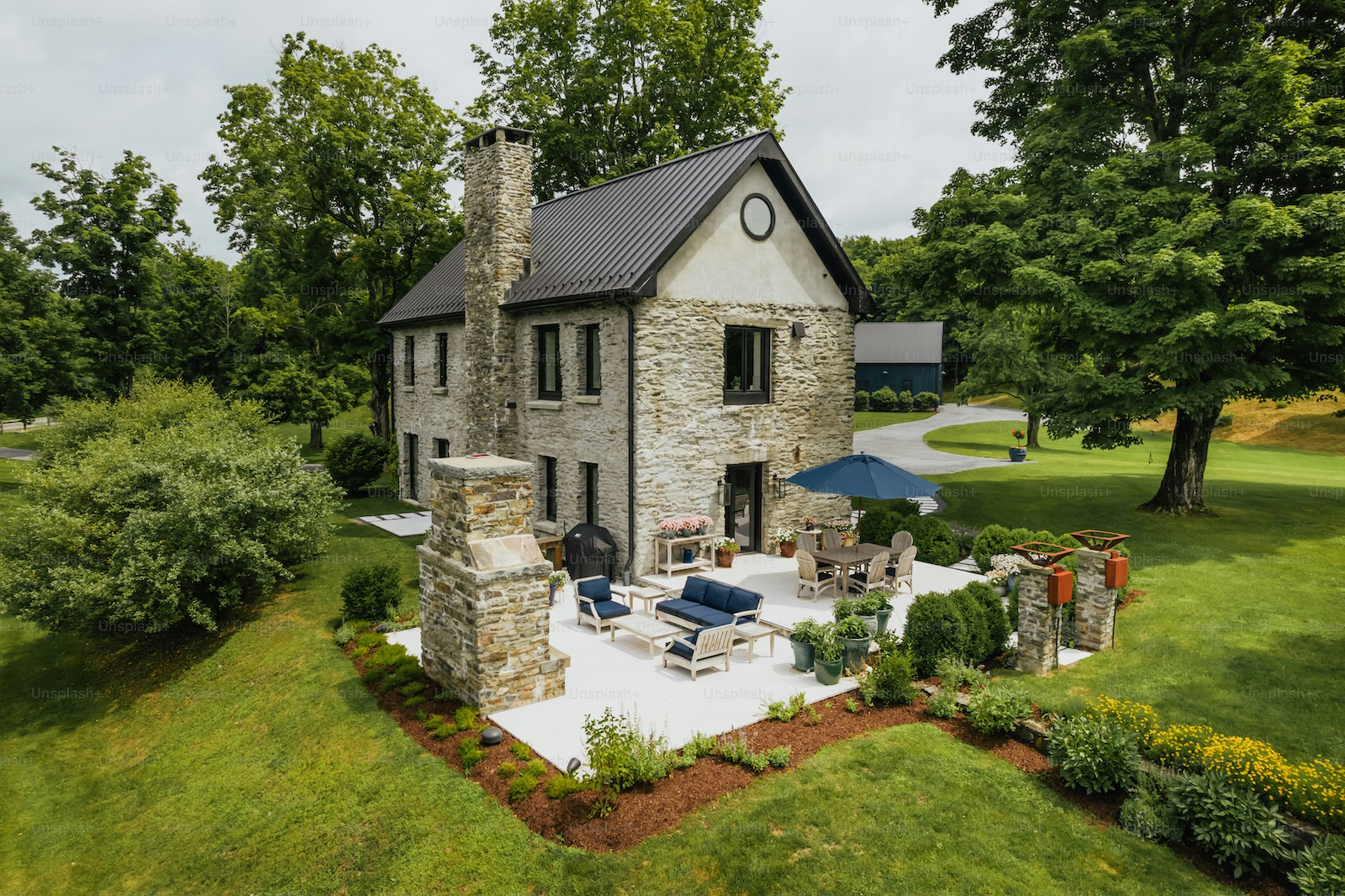 Stone house with patio and outdoor seating
